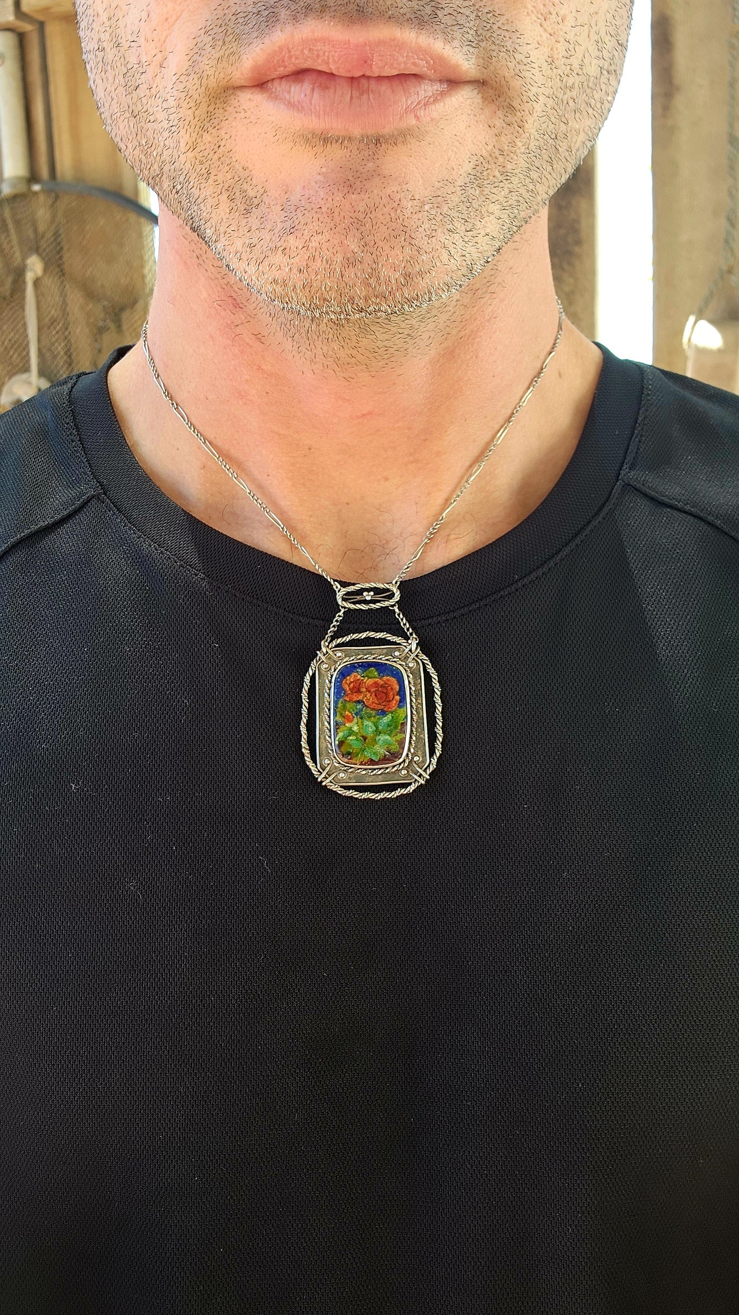 This antique sterling silver and enamel necklace is a striking example of the Arts and Crafts Movement, a design era (c. 1880–1920) that championed handcrafted, nature-inspired jewelry as a response to the mass production of the Industrial Revolution.
