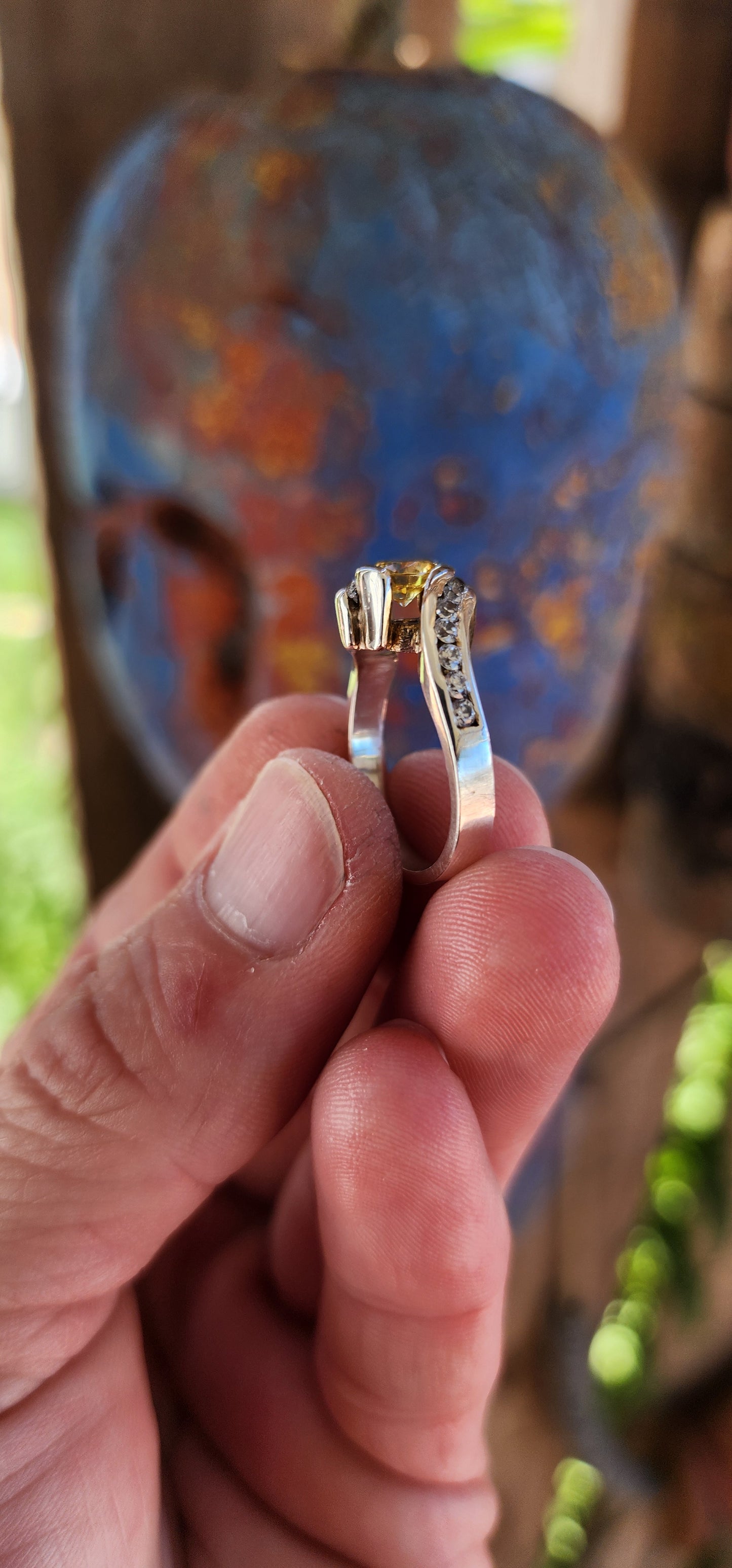 This breathtaking handmade sterling silver ring is a true work of art, seamlessly blending contemporary elegance with timeless beauty. The fluid, sculptural crossover design of the band exudes modernity while maintaining an air of classic refinement.