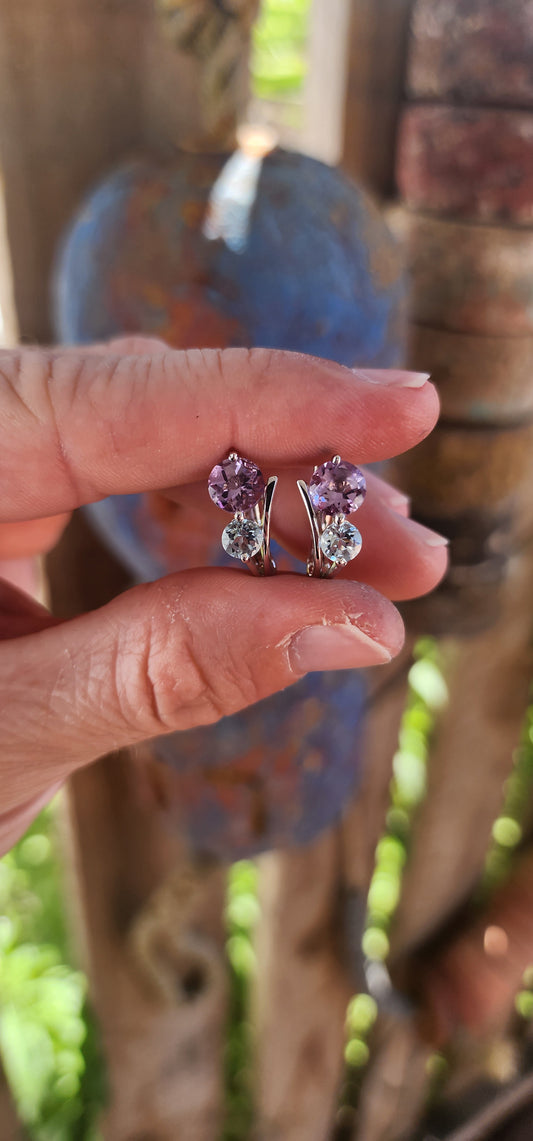 Like a stardust-kissed evening sky, these sterling silver huggie style earrings blend the mystical charm of twilight hues with the elegance of timeless craftsmanship.