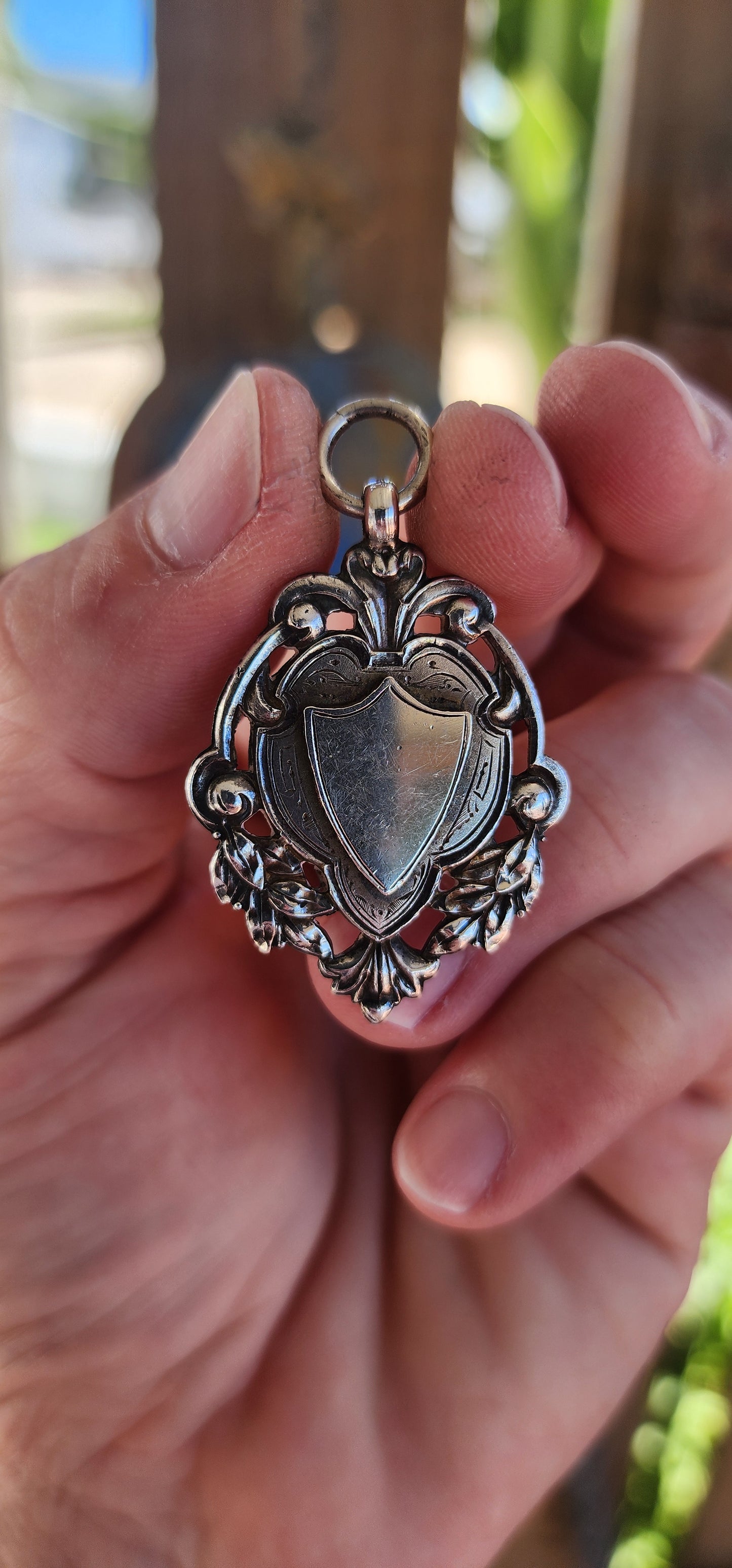 This exquisite and highly detailed hallmarked sterling silver fob pendant, crafted by the renowned silversmith William James Dingley, is an outstanding example of early 20th-century British silverwork.