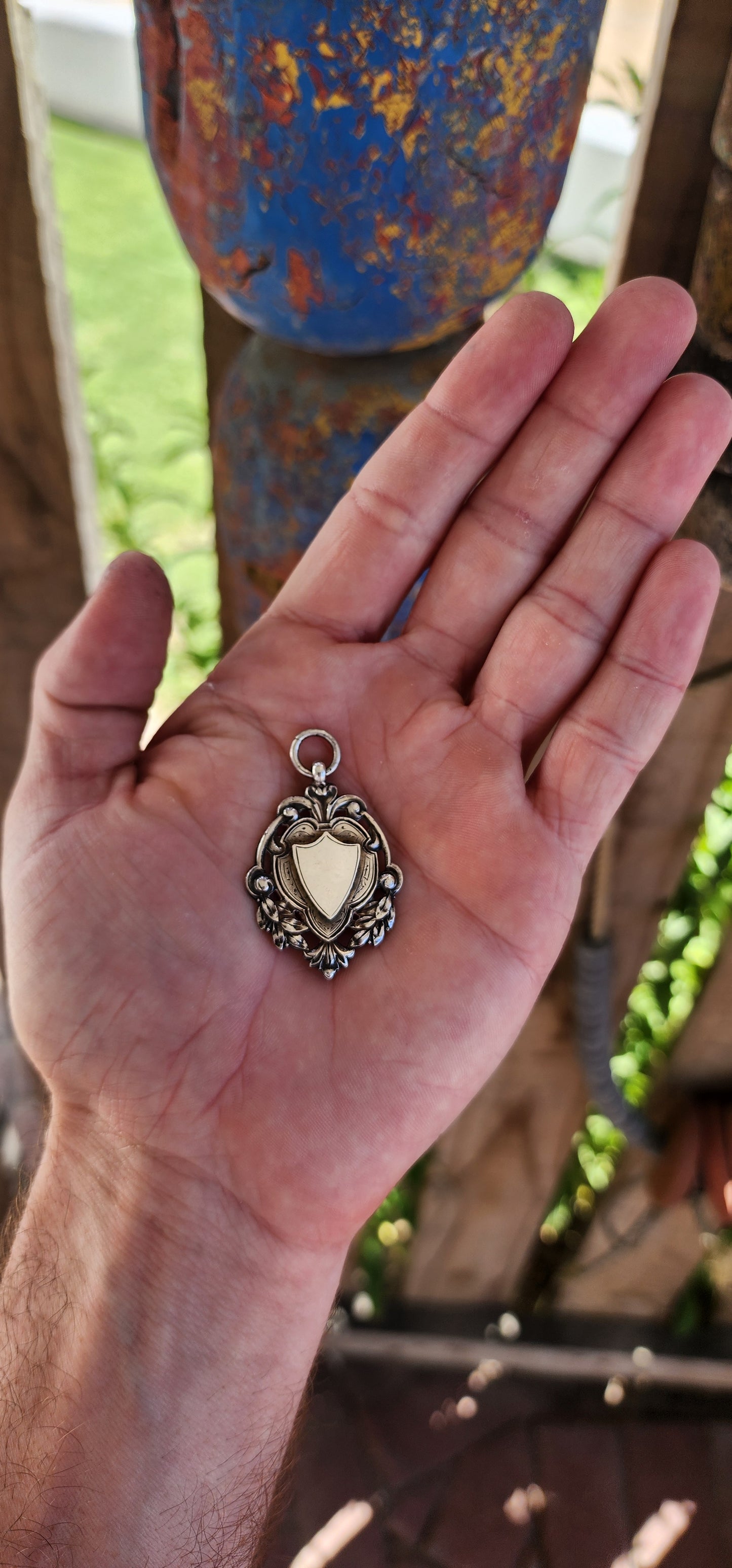 This exquisite and highly detailed hallmarked sterling silver fob pendant, crafted by the renowned silversmith William James Dingley, is an outstanding example of early 20th-century British silverwork.