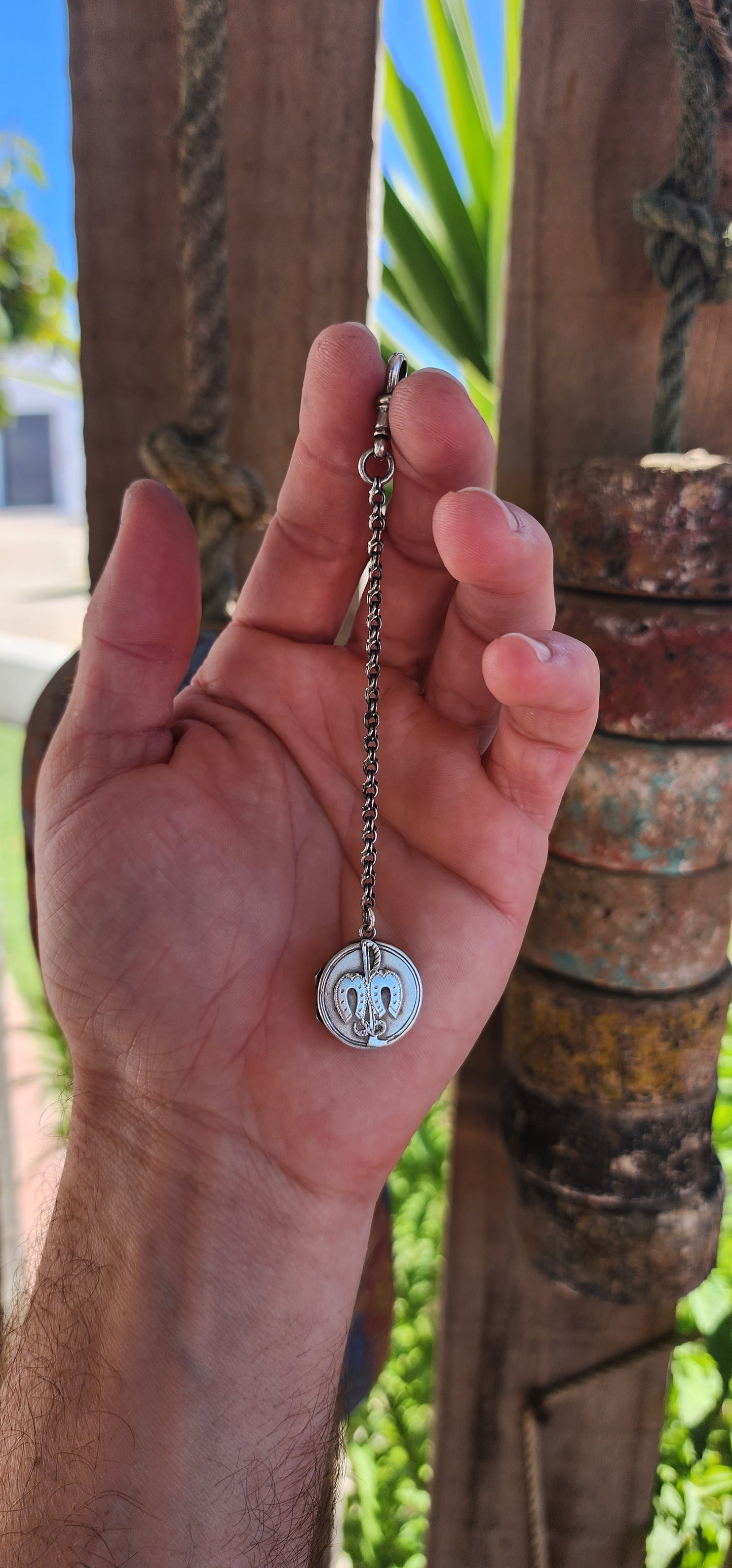 This hallmarked sterling silver Victorian equestrian keepsake locket is a fine example of late 19th-century craftsmanship. It was made in Birmingham around 1898, as confirmed by the hallmarks.