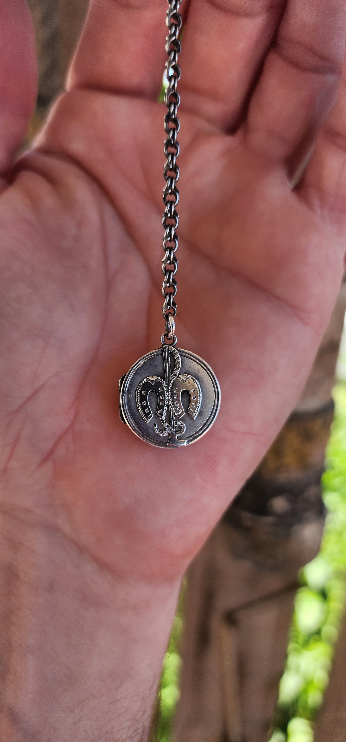 This hallmarked sterling silver Victorian equestrian keepsake locket is a fine example of late 19th-century craftsmanship. It was made in Birmingham around 1898, as confirmed by the hallmarks.