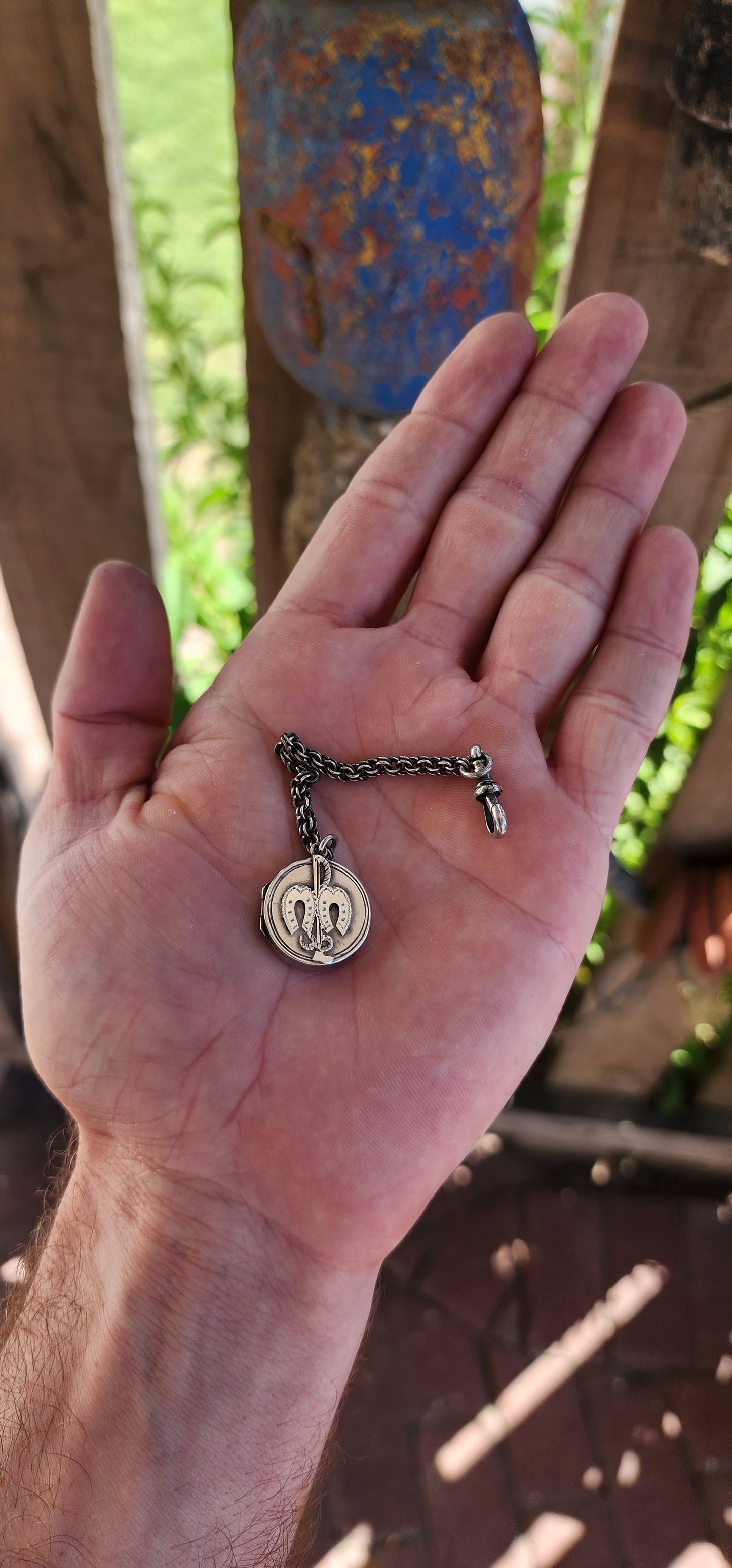 This hallmarked sterling silver Victorian equestrian keepsake locket is a fine example of late 19th-century craftsmanship. It was made in Birmingham around 1898, as confirmed by the hallmarks.
