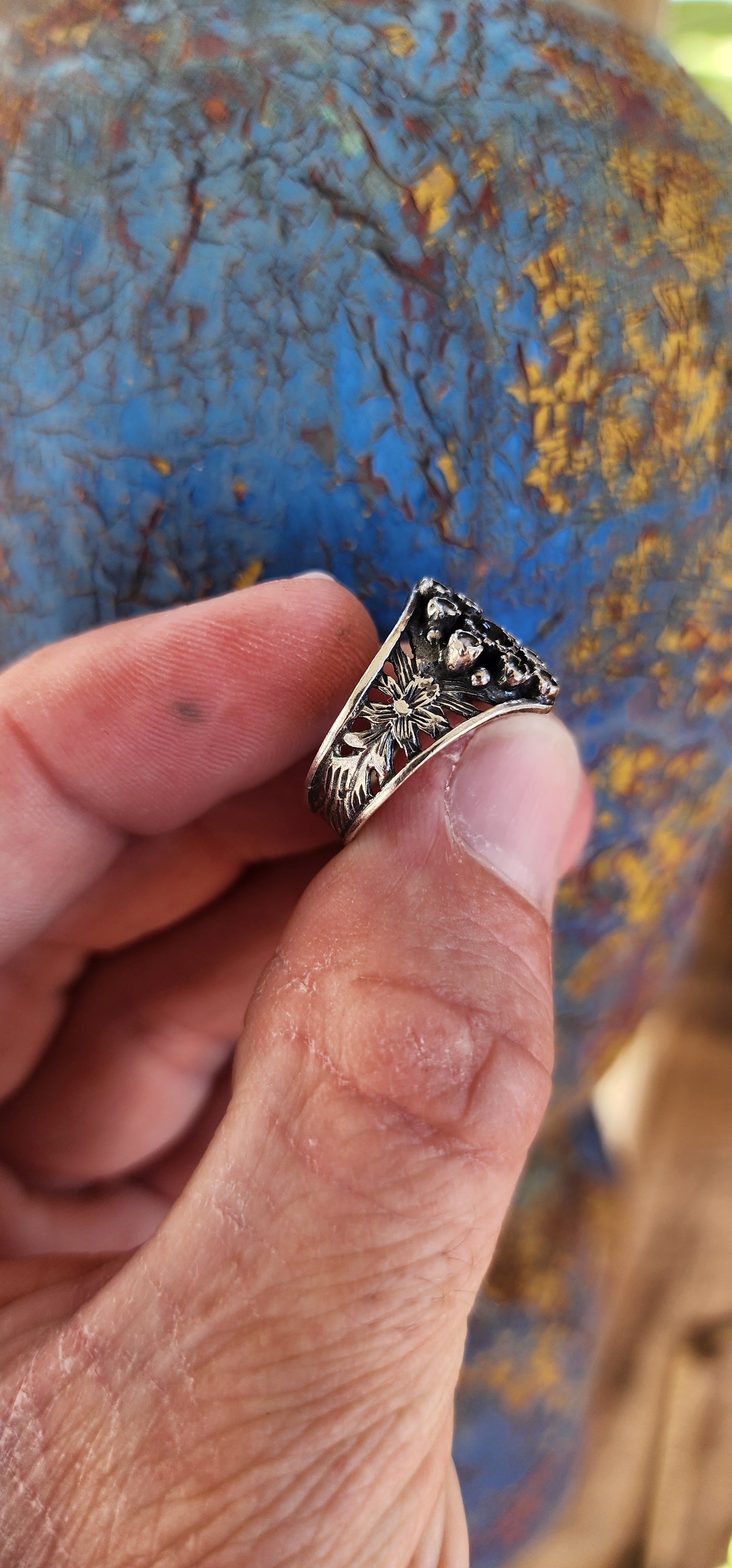 This vintage sterling silver ring is a striking piece with Victorian Gothic influences, showcasing intricate craftsmanship and elegant detailing.