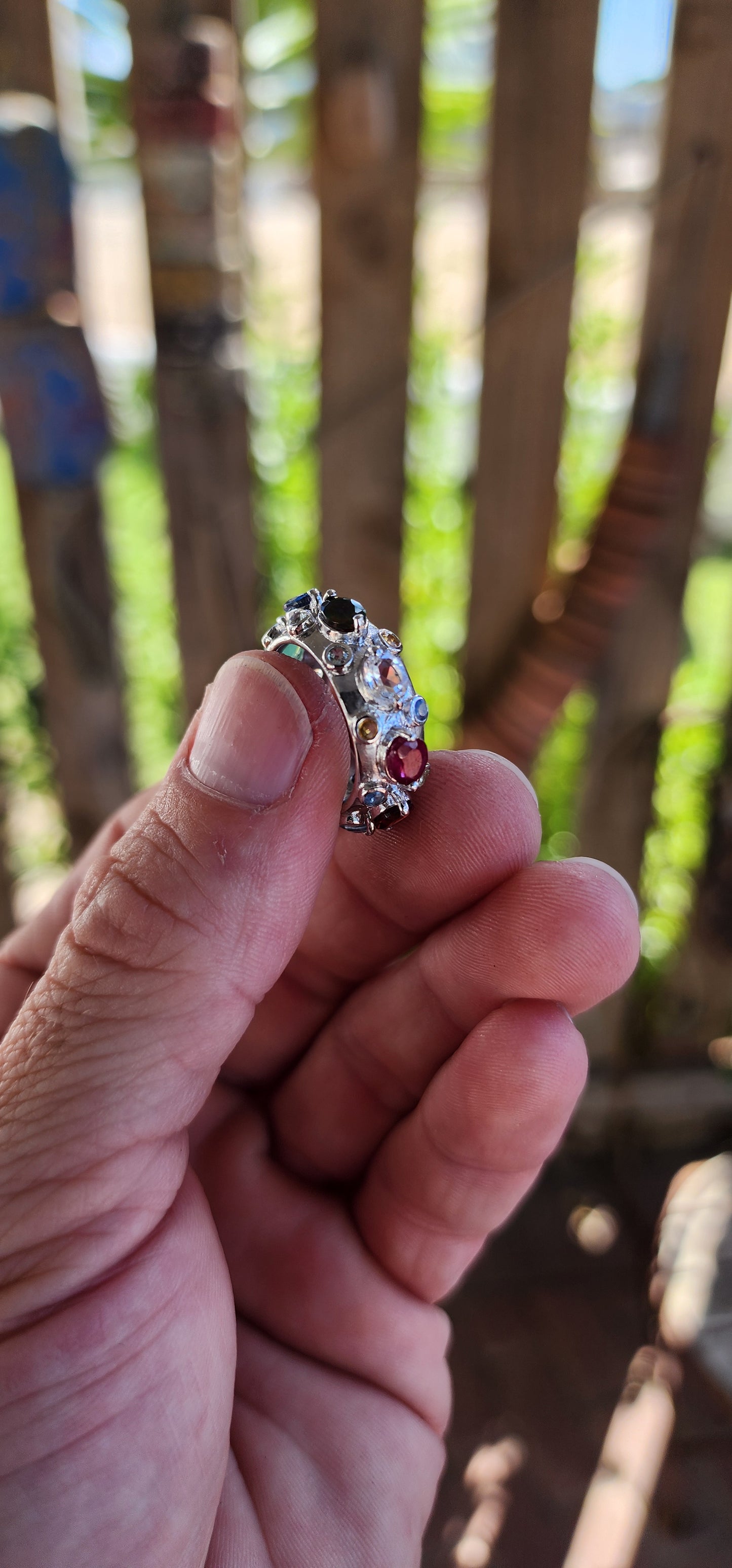 This Tutti Frutti Full Eternity Cocktail Ring is a riot of color, an exquisite fusion of light and energy, crafted in solid sterling silver and adorned with a spectacular array of natural gemstones.