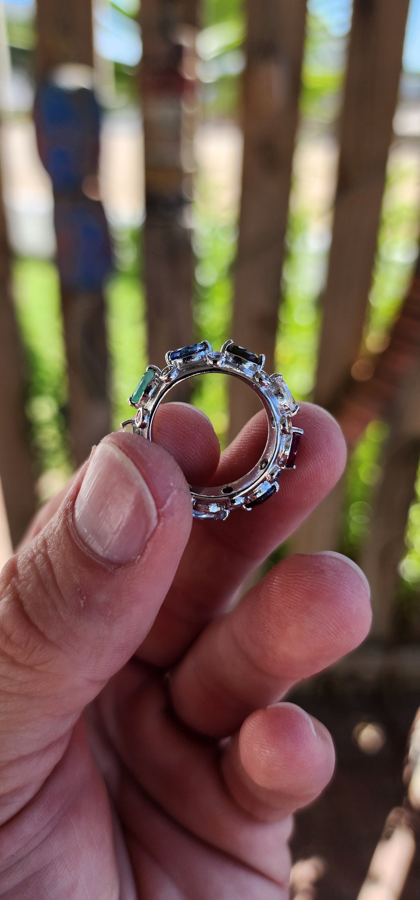 This Tutti Frutti Full Eternity Cocktail Ring is a riot of color, an exquisite fusion of light and energy, crafted in solid sterling silver and adorned with a spectacular array of natural gemstones.