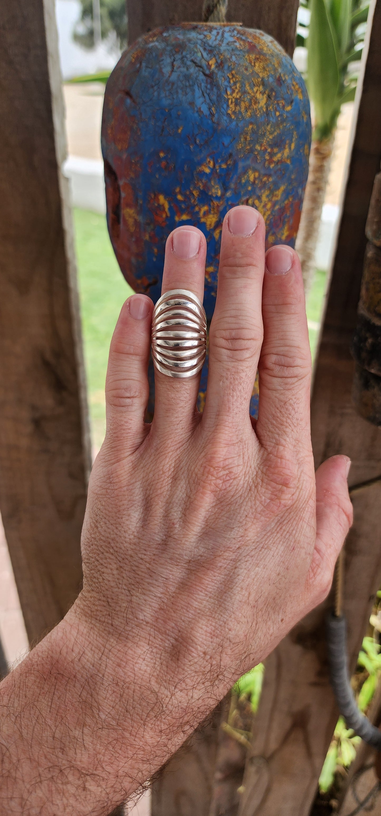 This striking sterling silver statement ring is a bold expression of modernist artistry, seamlessly blending sculptural aesthetics with wearable design.