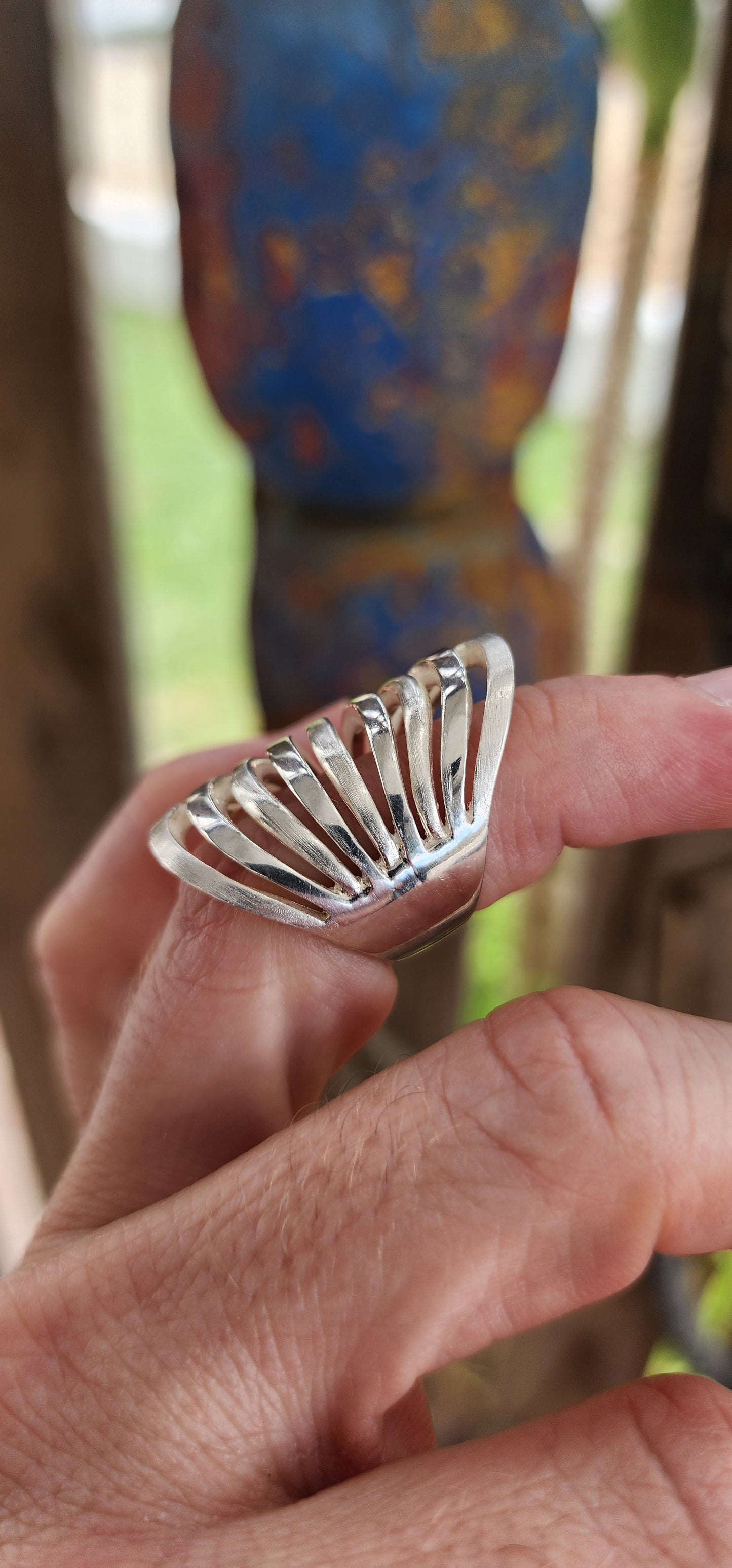 This striking sterling silver statement ring is a bold expression of modernist artistry, seamlessly blending sculptural aesthetics with wearable design.