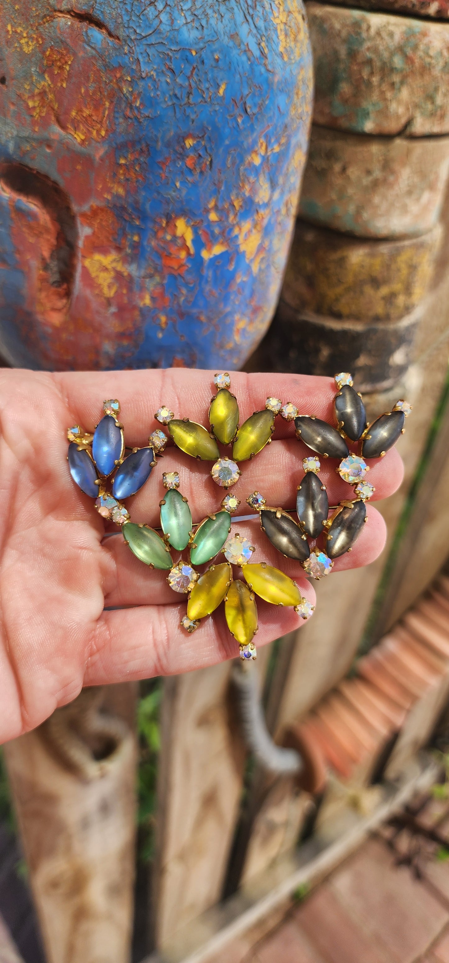 Why settle for one....when you can have six ?!
This stunning collection consists of six perfectly matching vintage costume brooches, each an exquisite display of frosted glass navette-cut stones set in rich brass metal.