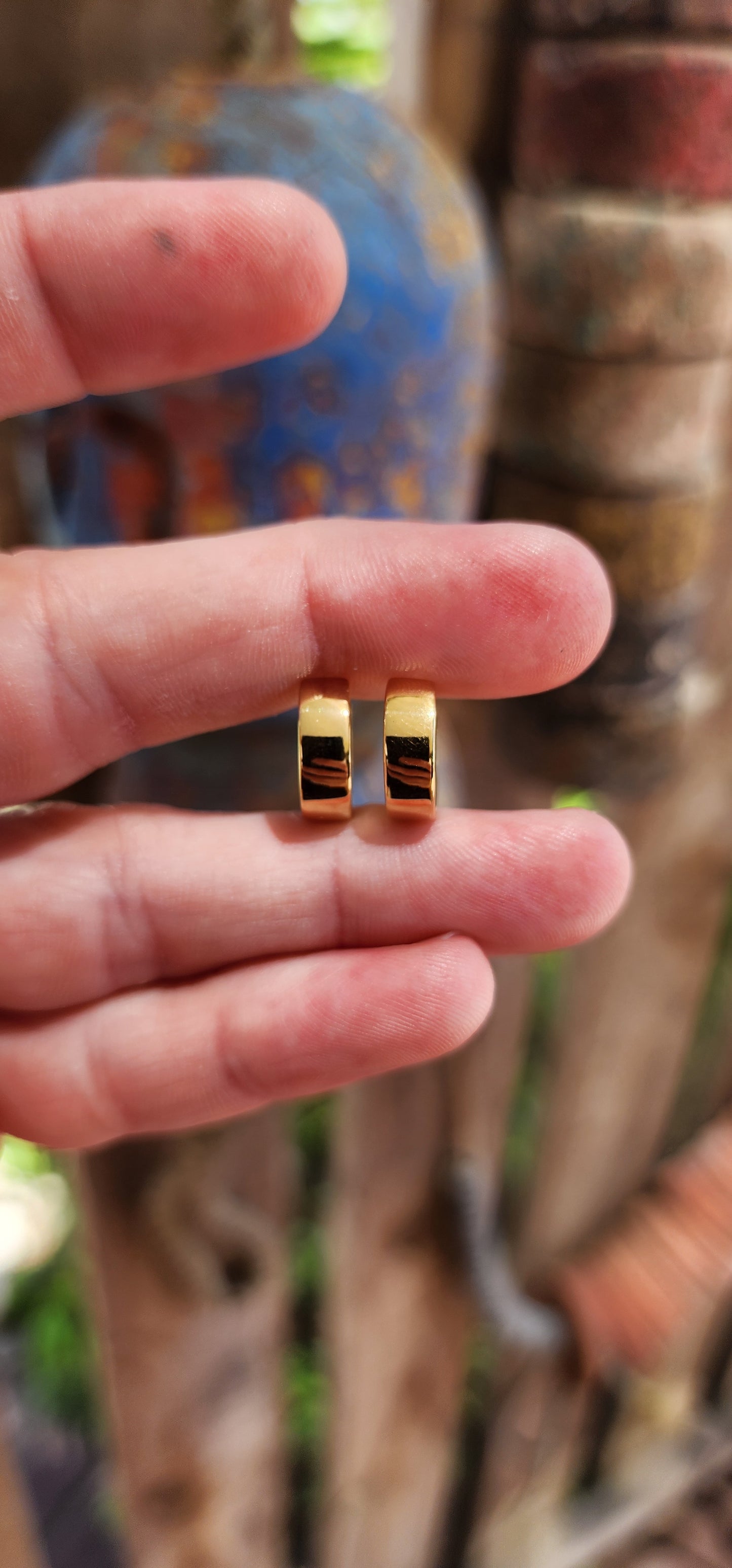 These sterling silver huggie earrings, plated with a radiant layer of 9ct yellow gold, embody the perfect blend of modern minimalism and classic elegance.