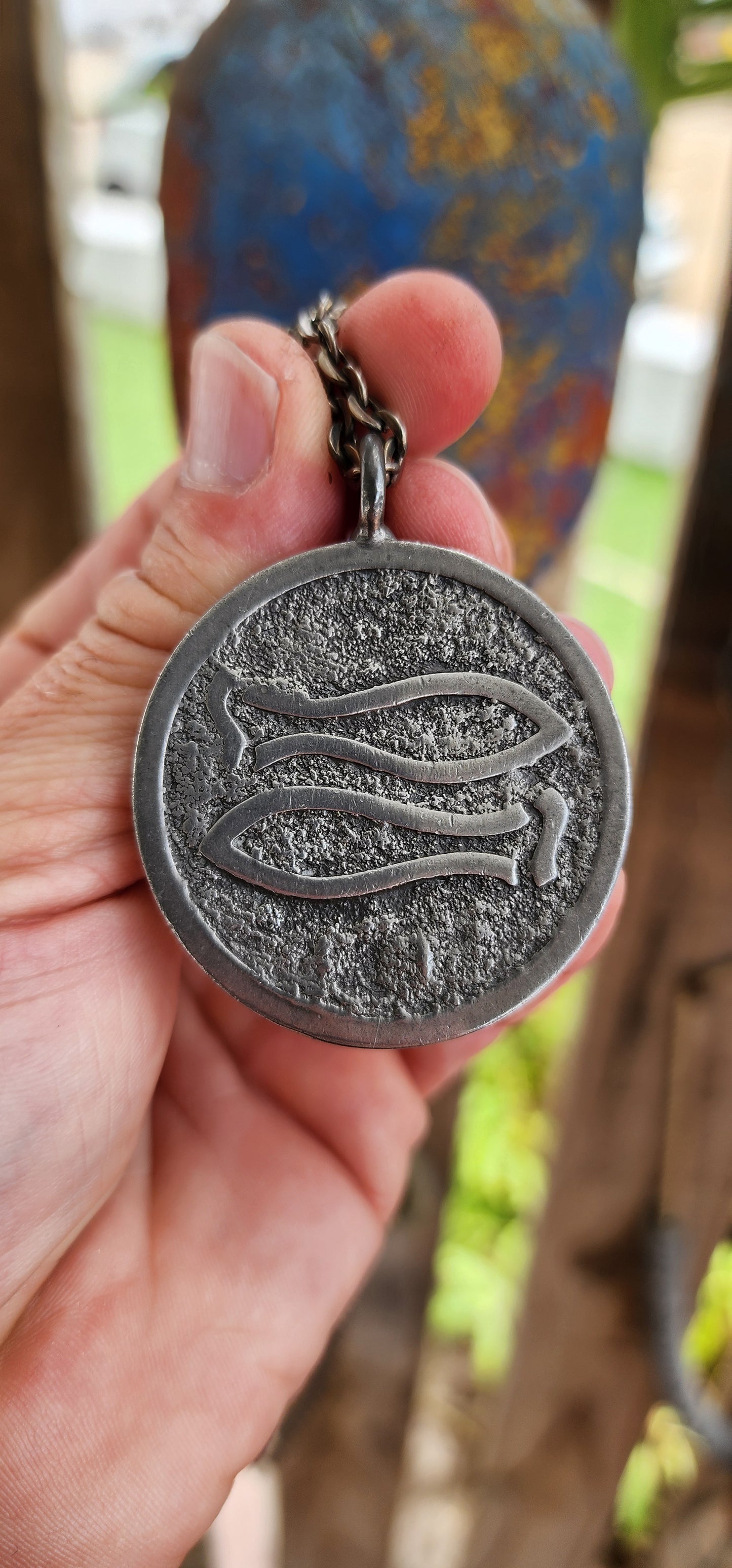 This vintage mid-century modernist pewter pendant, crafted by renowned Danish silversmith Jørgen Jensen, is a striking example of Scandinavian modernist jewelry.