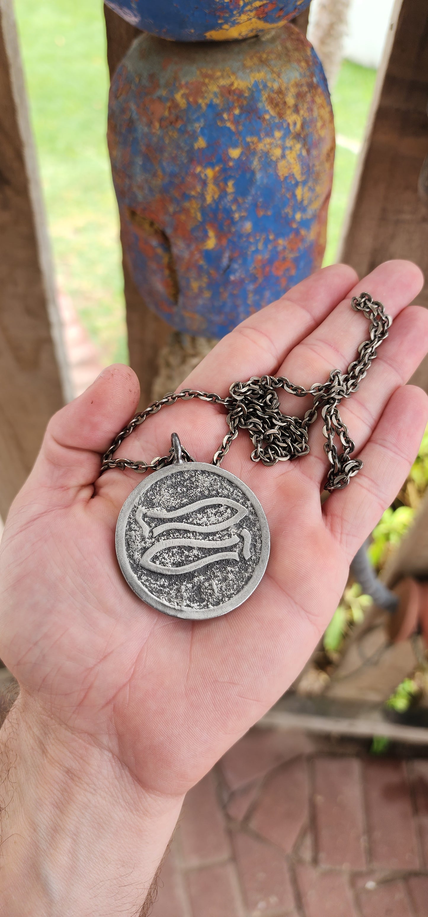 This vintage mid-century modernist pewter pendant, crafted by renowned Danish silversmith Jørgen Jensen, is a striking example of Scandinavian modernist jewelry.