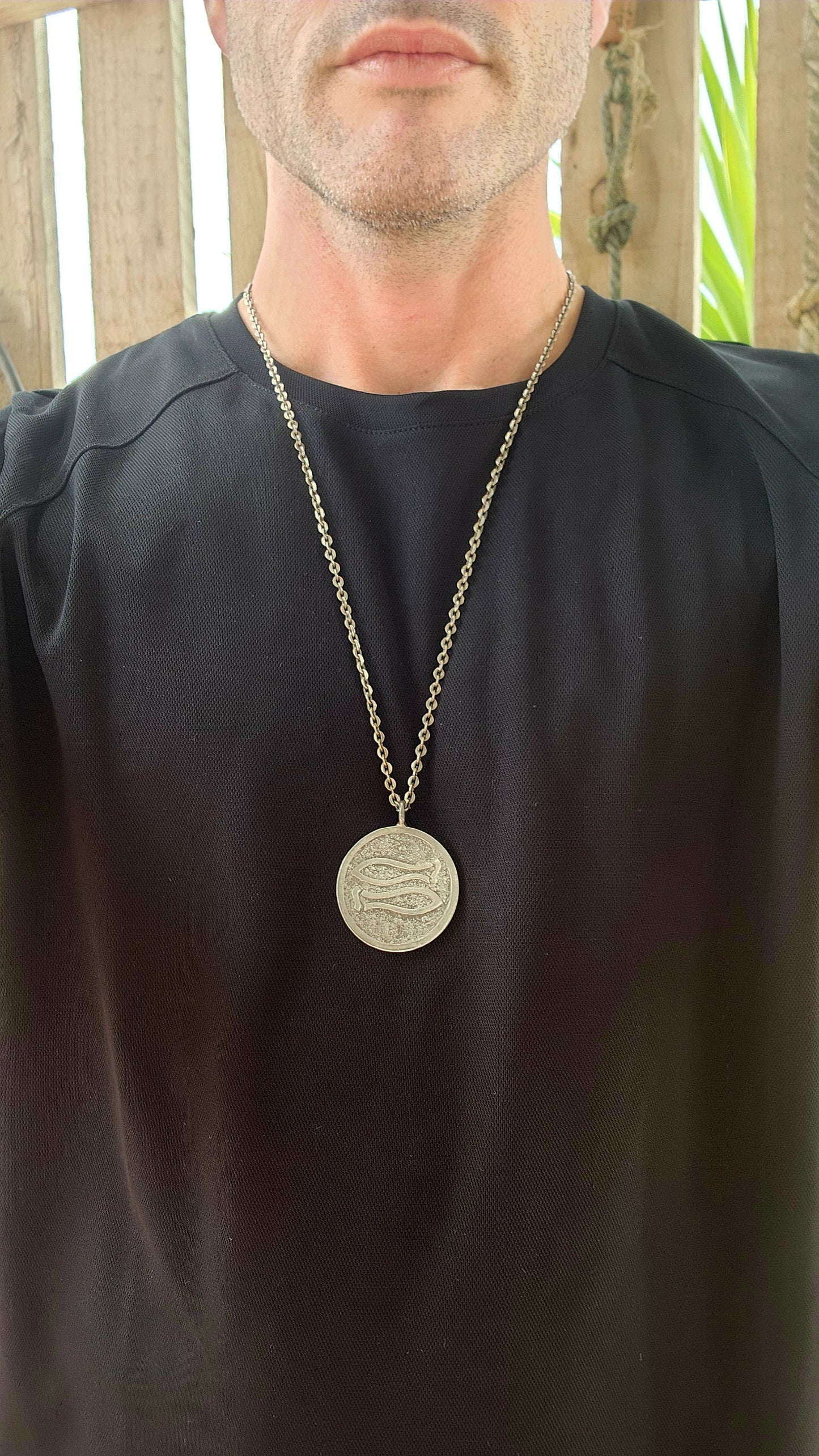 This vintage mid-century modernist pewter pendant, crafted by renowned Danish silversmith Jørgen Jensen, is a striking example of Scandinavian modernist jewelry.