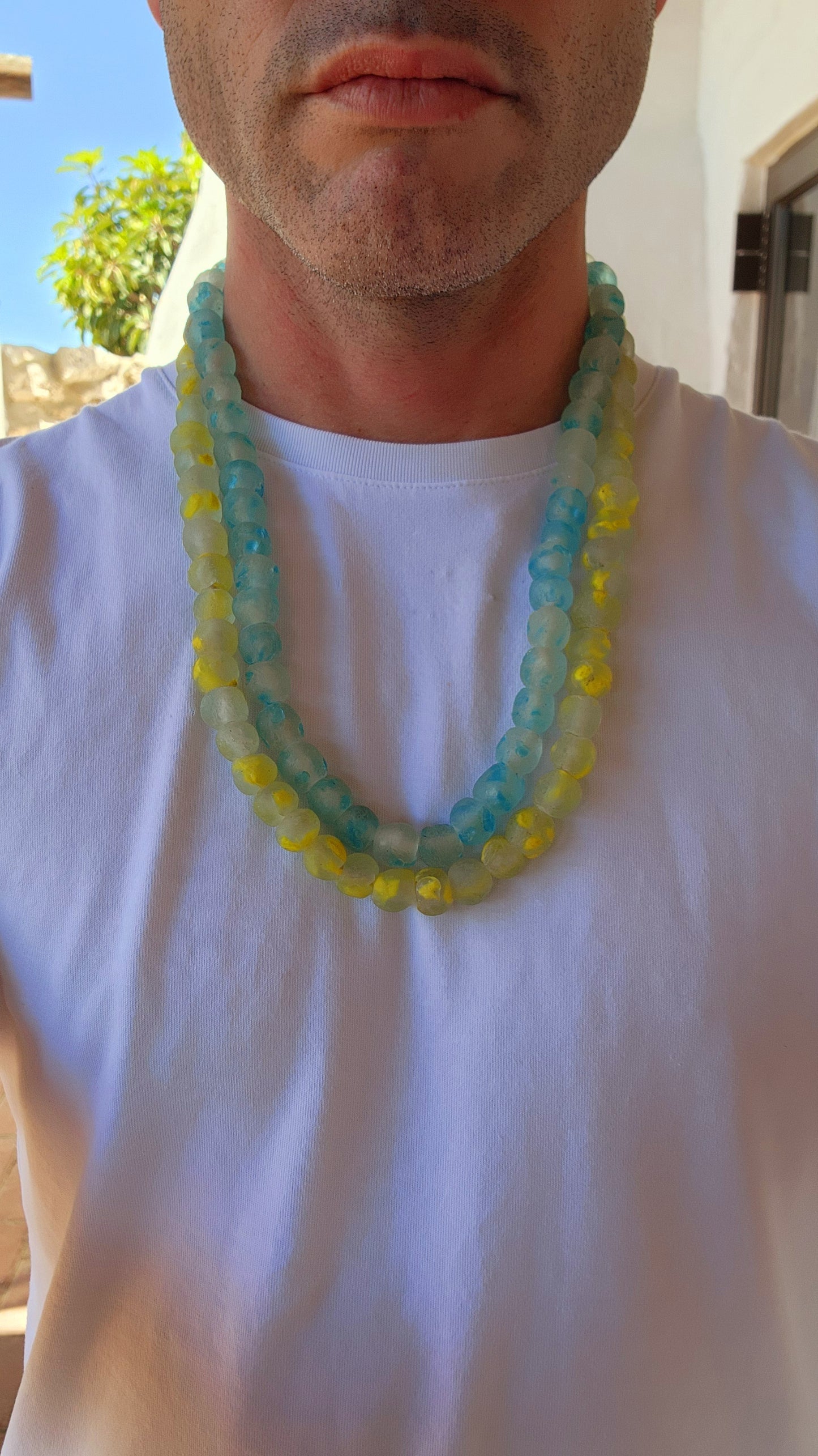 These chunky Krobo recycled glass necklaces are like little bursts of West African sunshine and ocean waves, captured in bead form.