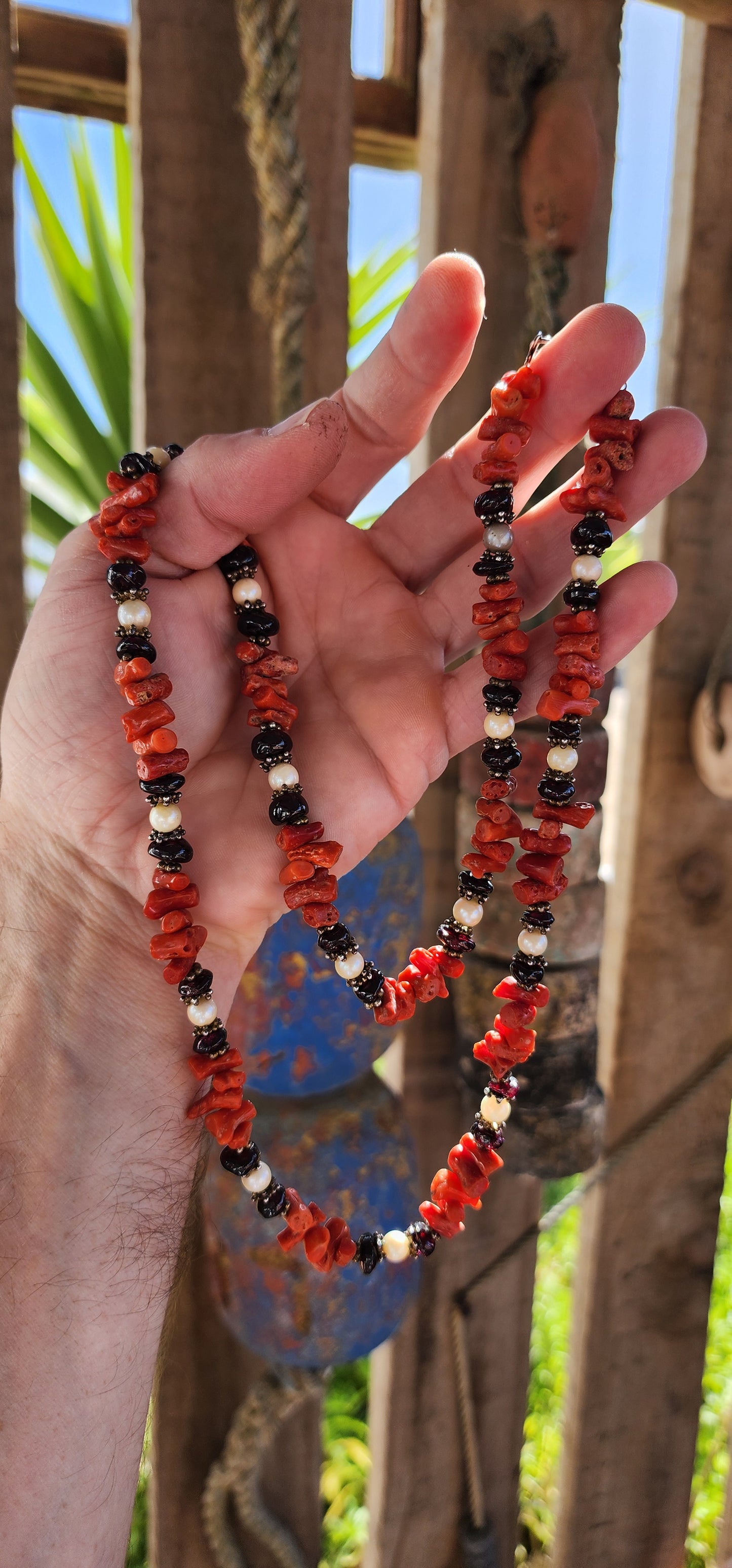 This marvelous vintage extra-length necklace is a striking embodiment of ethnic and tribal artistry, seamlessly blending organic materials with masterful craftsmanship.