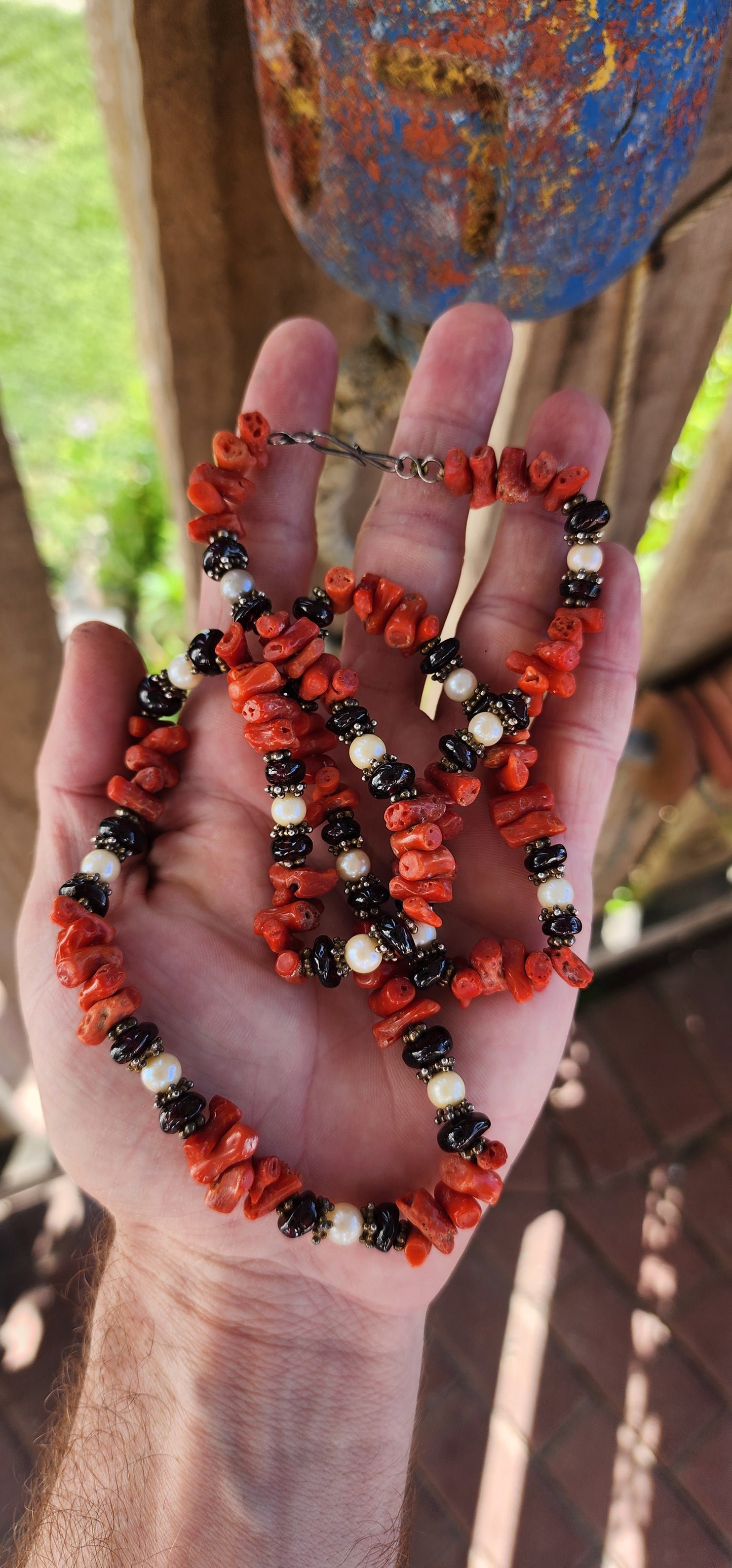 This marvelous vintage extra-length necklace is a striking embodiment of ethnic and tribal artistry, seamlessly blending organic materials with masterful craftsmanship.