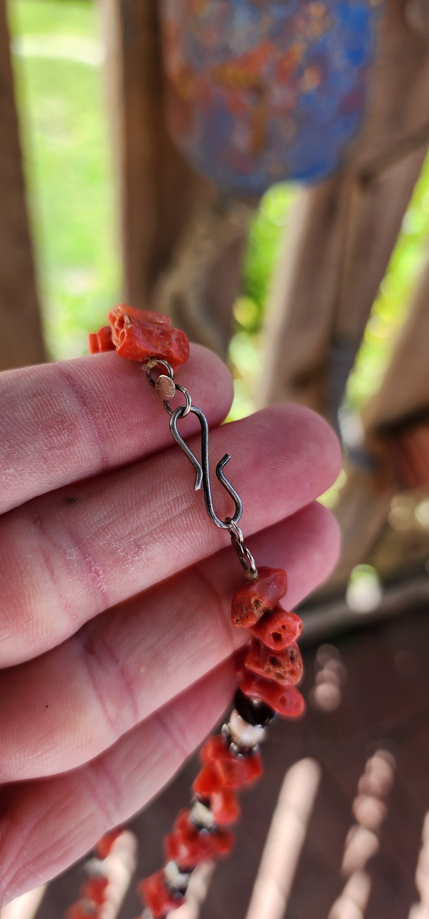 This marvelous vintage extra-length necklace is a striking embodiment of ethnic and tribal artistry, seamlessly blending organic materials with masterful craftsmanship.