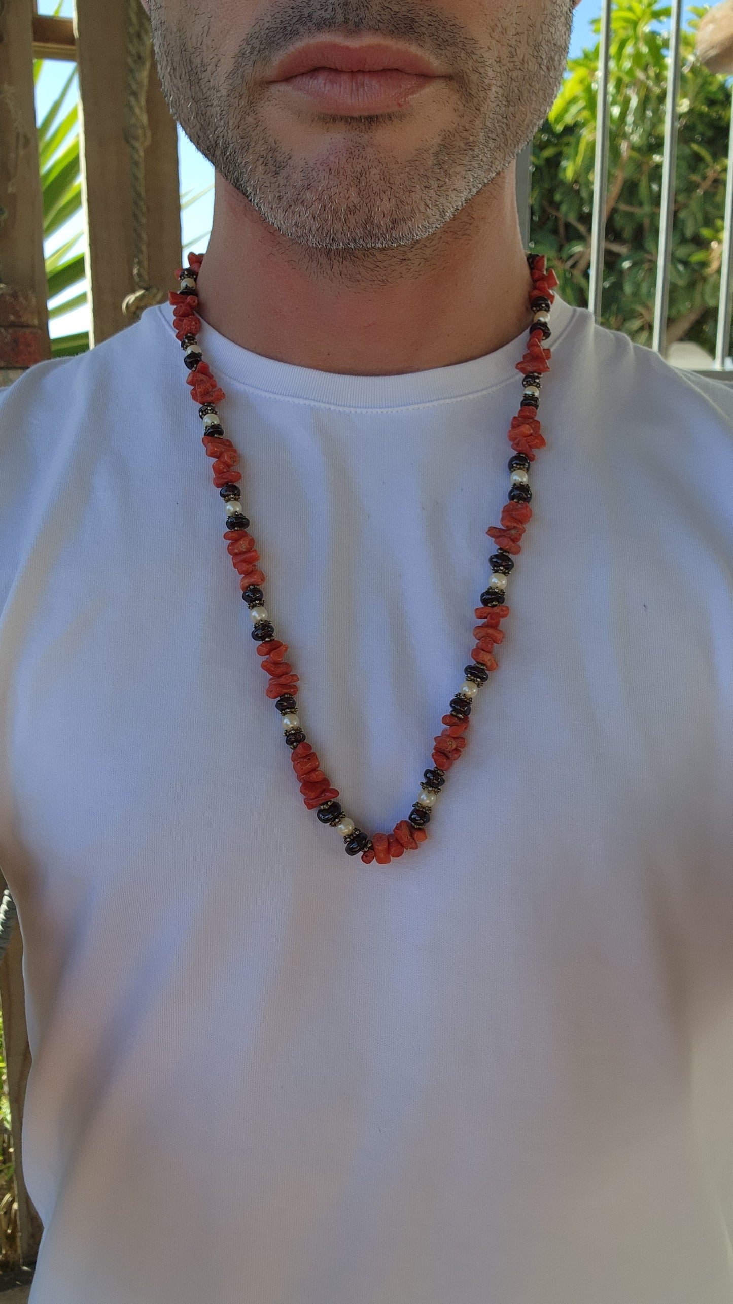 This marvelous vintage extra-length necklace is a striking embodiment of ethnic and tribal artistry, seamlessly blending organic materials with masterful craftsmanship.