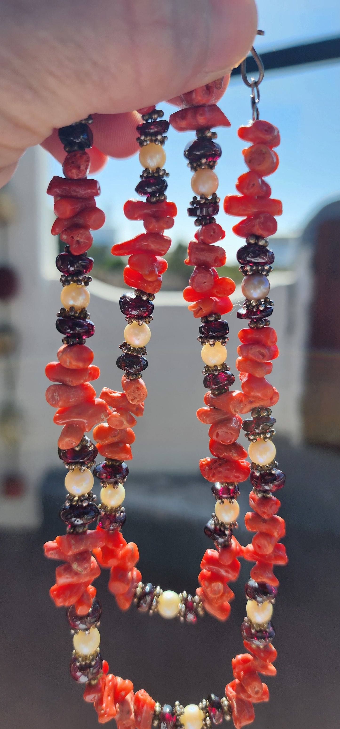 This marvelous vintage extra-length necklace is a striking embodiment of ethnic and tribal artistry, seamlessly blending organic materials with masterful craftsmanship.