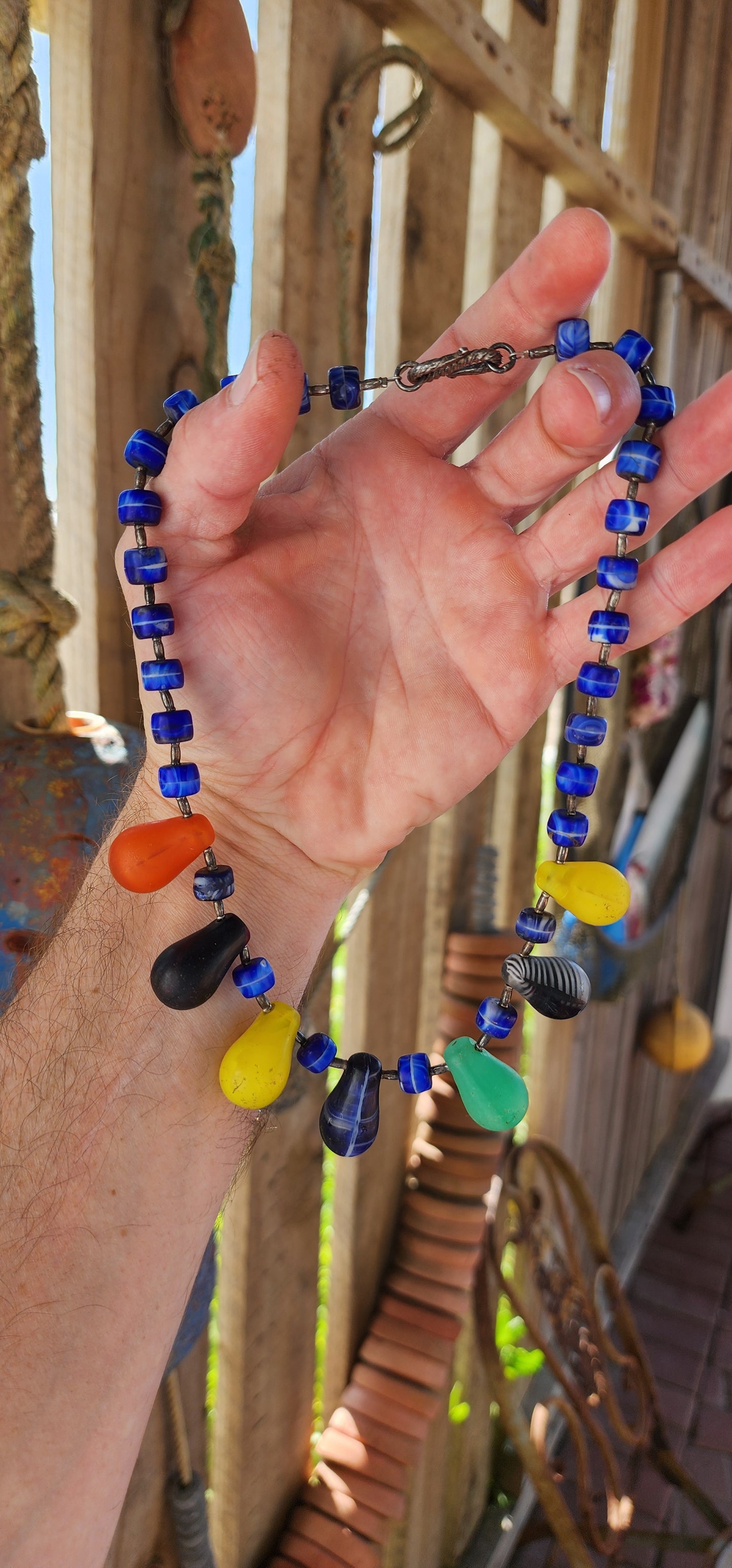 This Antique Early 1900s "Mali Wedding" Glass Beads Trade Necklace is a fascinating piece with a rich history rooted in the African trade and European glassmaking traditions.