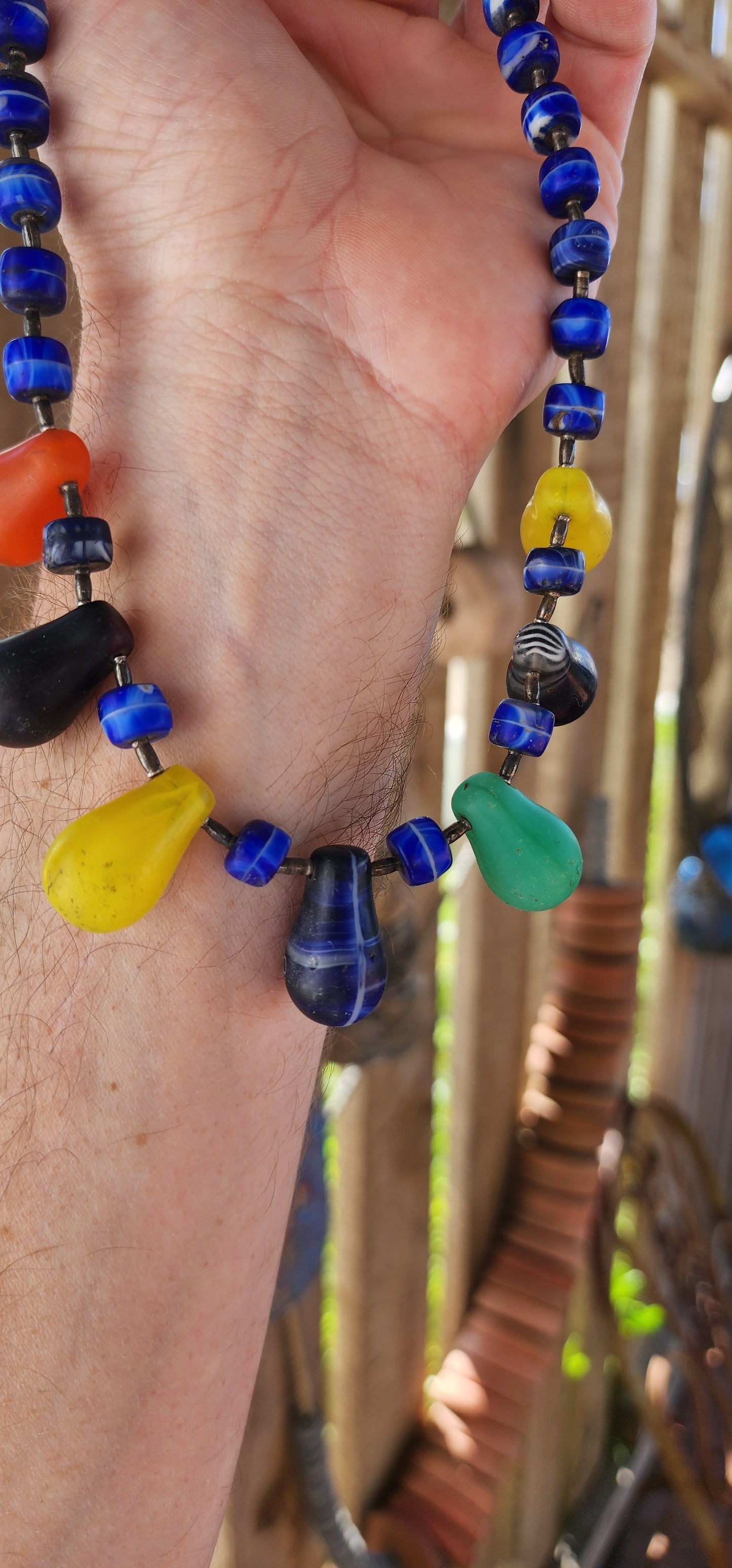 This Antique Early 1900s "Mali Wedding" Glass Beads Trade Necklace is a fascinating piece with a rich history rooted in the African trade and European glassmaking traditions.