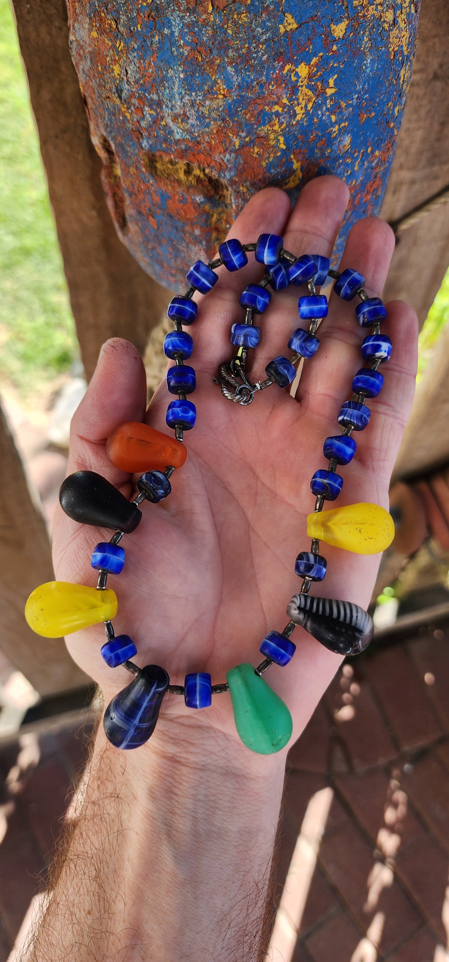 This Antique Early 1900s "Mali Wedding" Glass Beads Trade Necklace is a fascinating piece with a rich history rooted in the African trade and European glassmaking traditions.