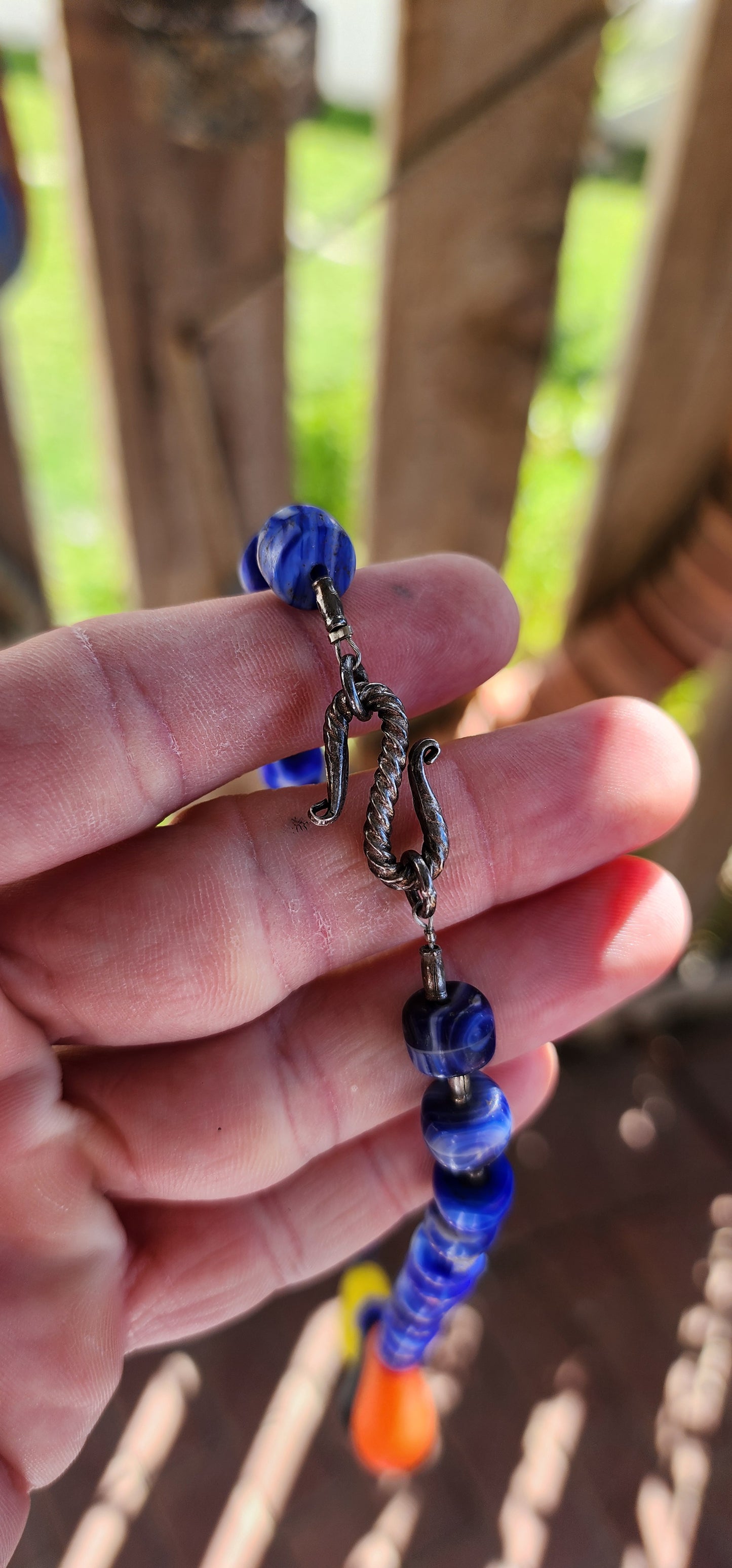 This Antique Early 1900s "Mali Wedding" Glass Beads Trade Necklace is a fascinating piece with a rich history rooted in the African trade and European glassmaking traditions.