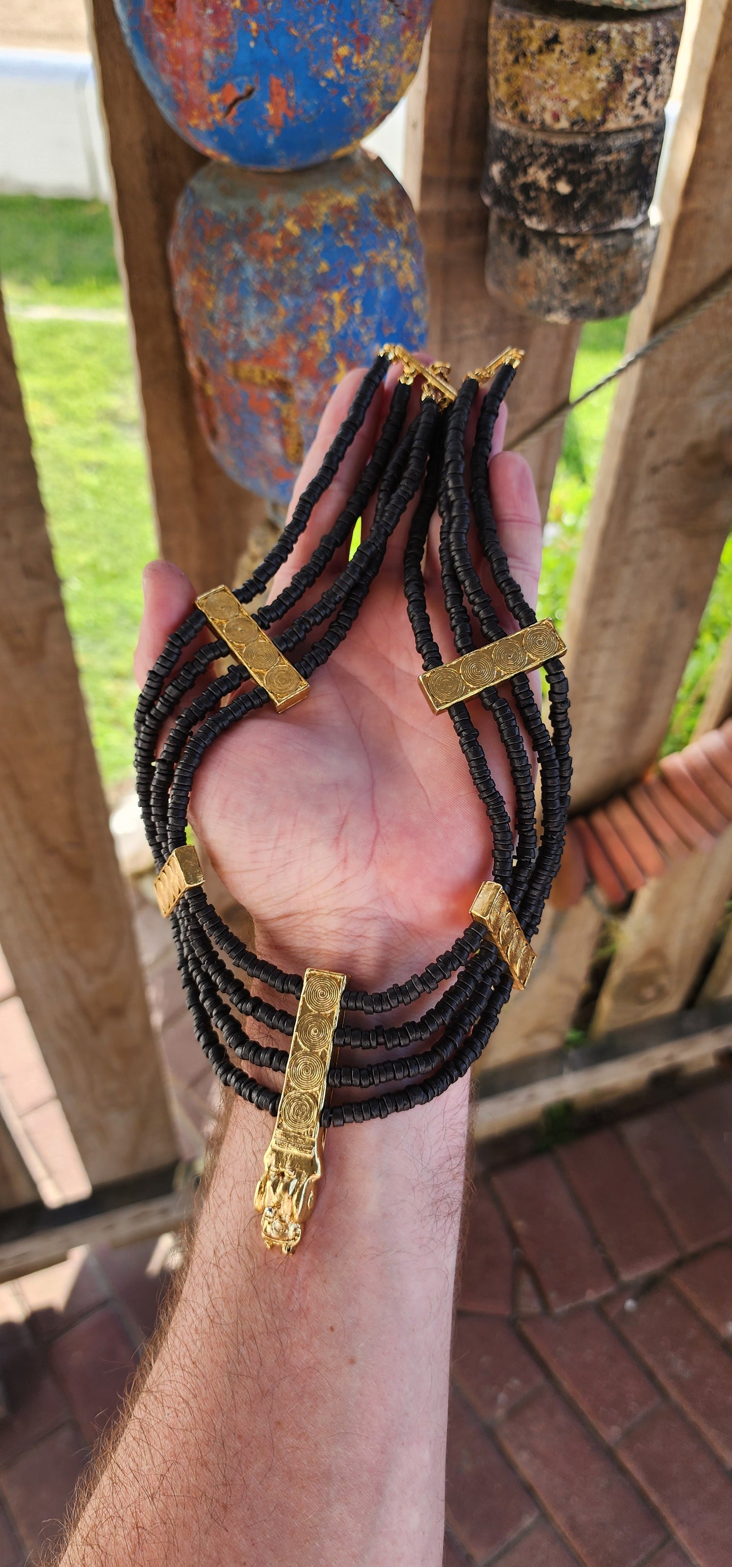 This marvelous Egyptian Revival collar necklace is a bold tribute to the splendor of ancient royalty, designed to grace the neck of a modern-day Cleopatra. Opulent yet commanding, its presence exudes power and wisdom.