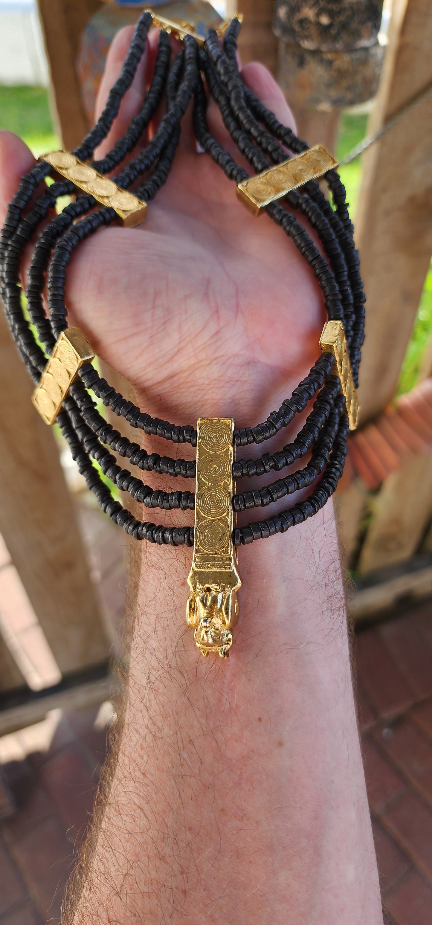 This marvelous Egyptian Revival collar necklace is a bold tribute to the splendor of ancient royalty, designed to grace the neck of a modern-day Cleopatra. Opulent yet commanding, its presence exudes power and wisdom.