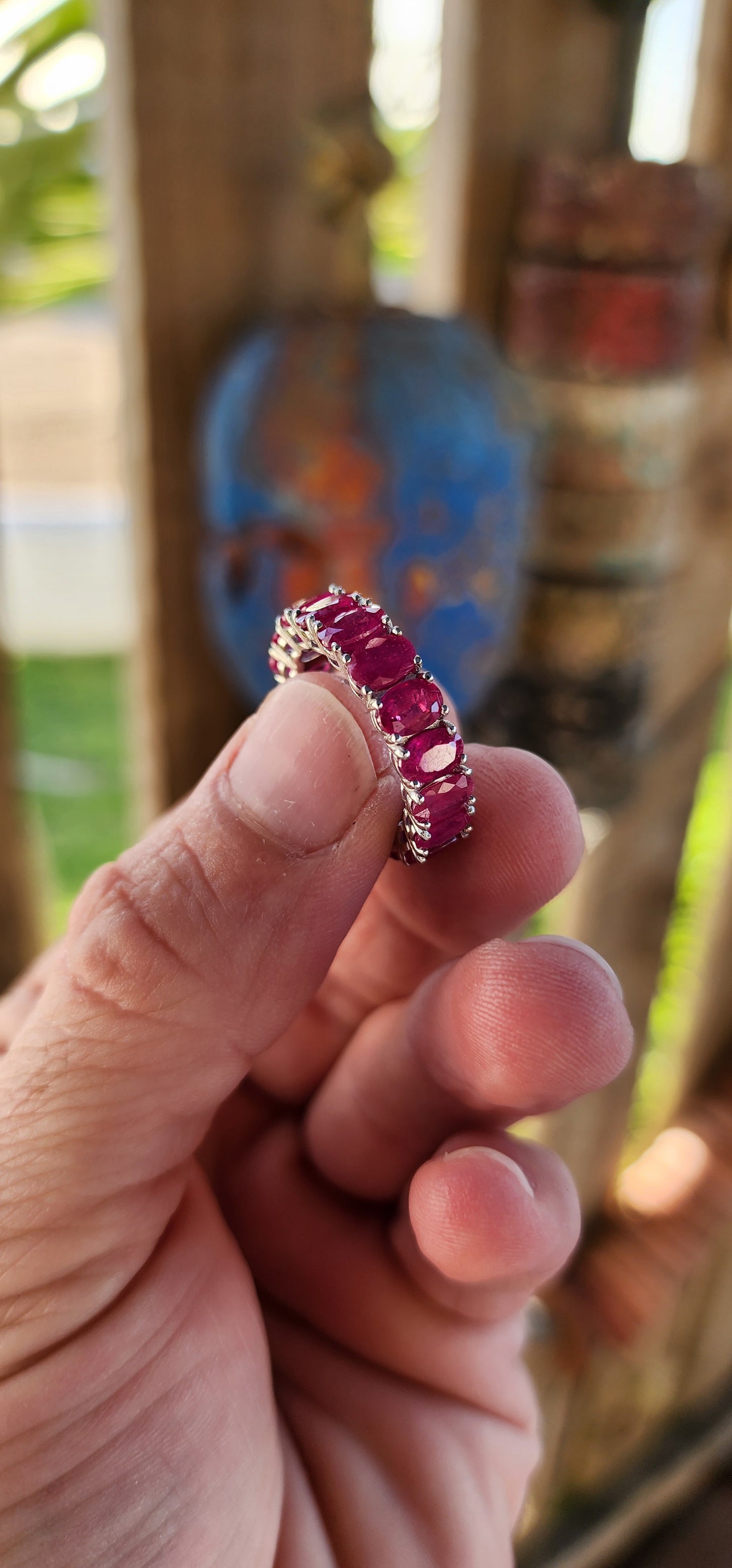 This eternity Ruby ring is a show-stopping piece of jewelry that balances elegance with a playful burst of color. Crafted from sterling silver, its full eternity design makes it a continuous circle of beauty, symbolizing everlasting love or commitment.