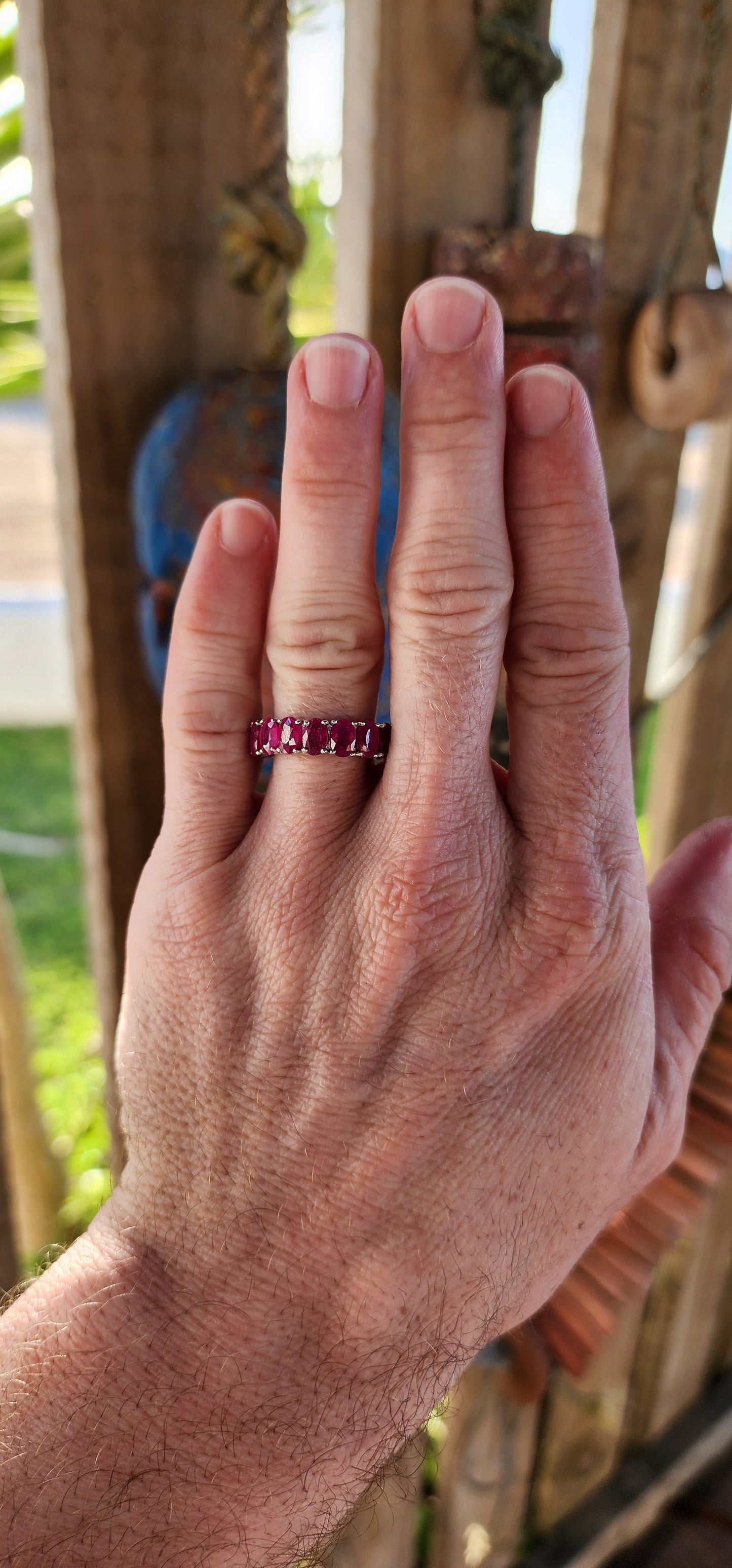 This eternity Ruby ring is a show-stopping piece of jewelry that balances elegance with a playful burst of color. Crafted from sterling silver, its full eternity design makes it a continuous circle of beauty, symbolizing everlasting love or commitment.