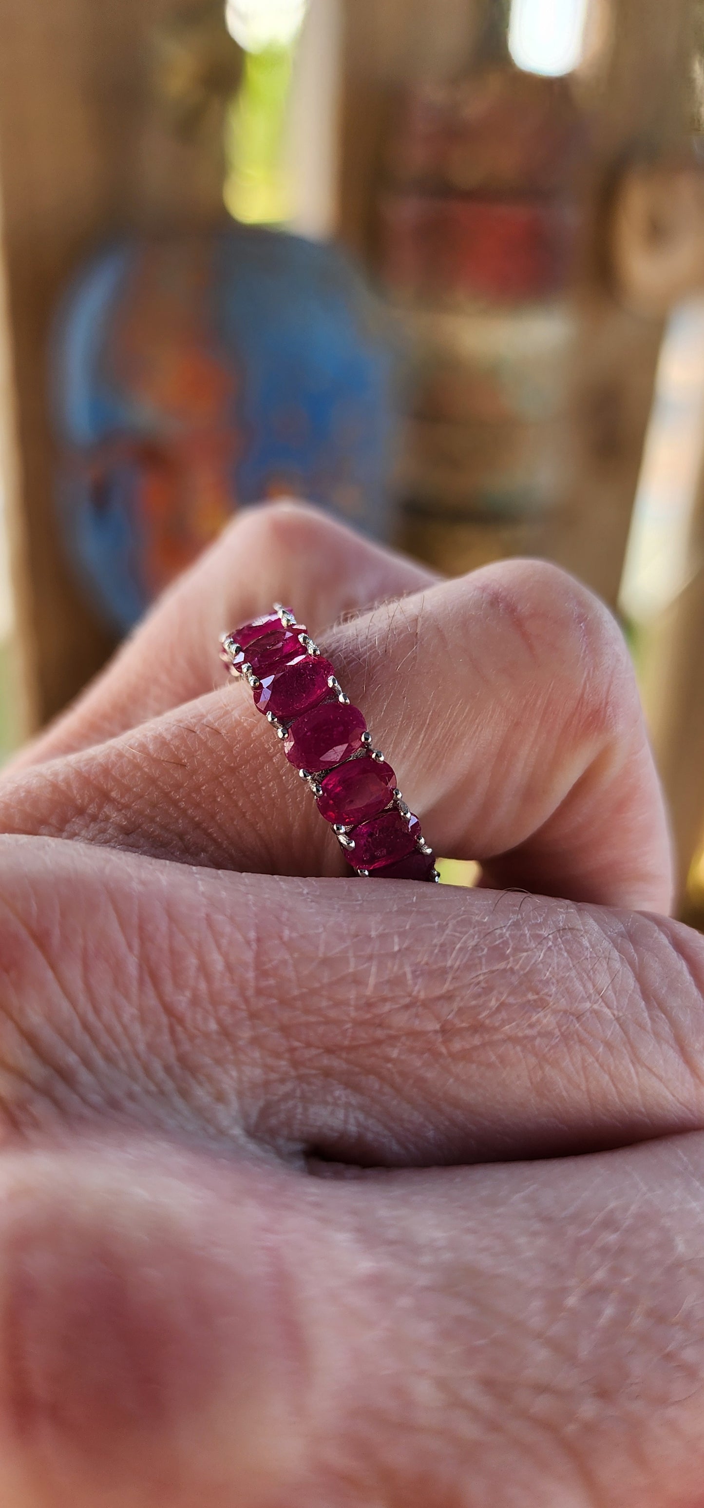 This eternity Ruby ring is a show-stopping piece of jewelry that balances elegance with a playful burst of color. Crafted from sterling silver, its full eternity design makes it a continuous circle of beauty, symbolizing everlasting love or commitment.