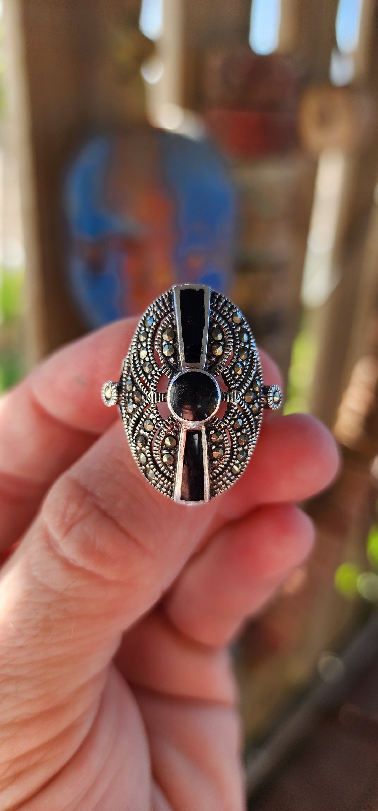 This stunning vintage 1990s sterling silver cocktail ring is a striking blend of Art Deco elegance and bold, statement-making design.