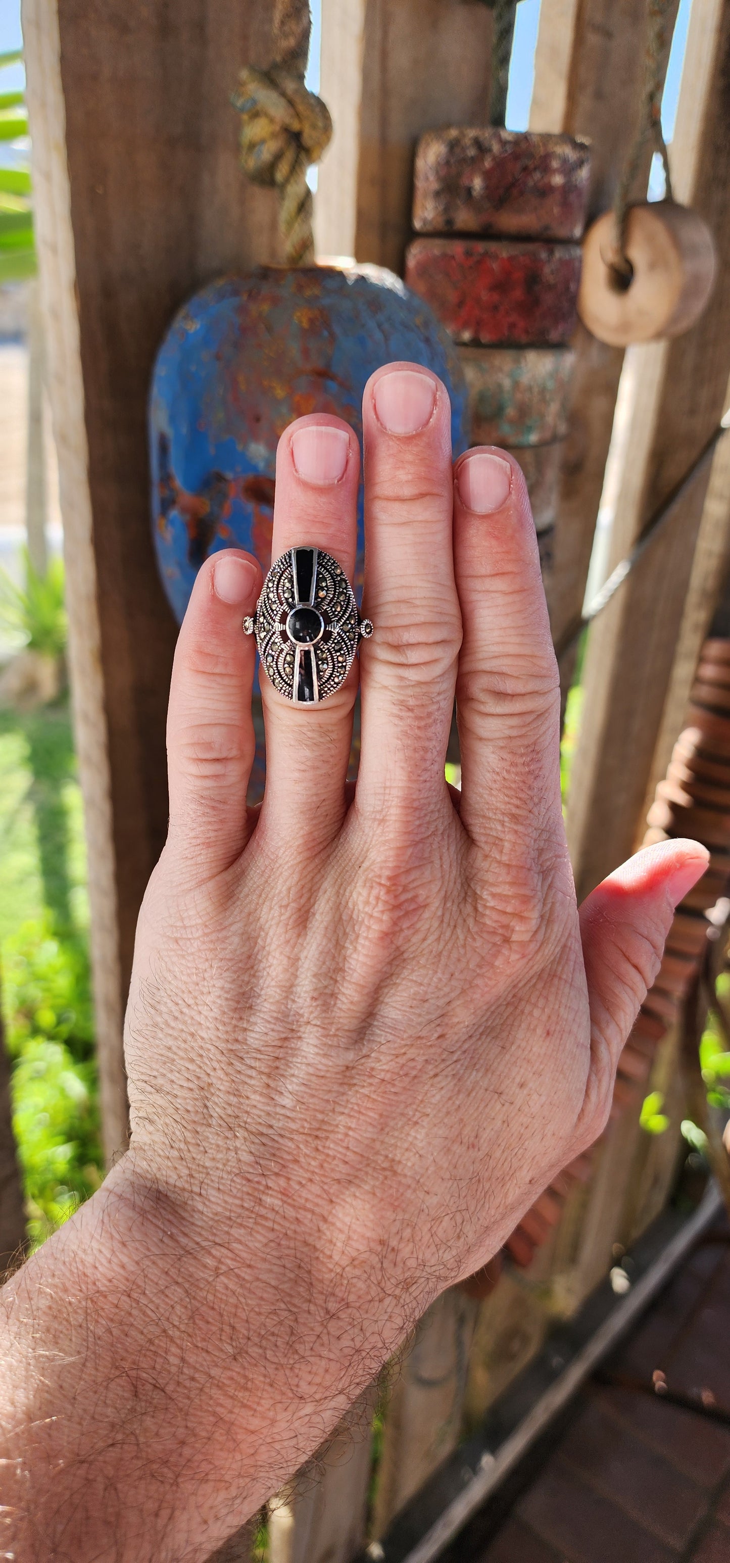 This stunning vintage 1990s sterling silver cocktail ring is a striking blend of Art Deco elegance and bold, statement-making design.