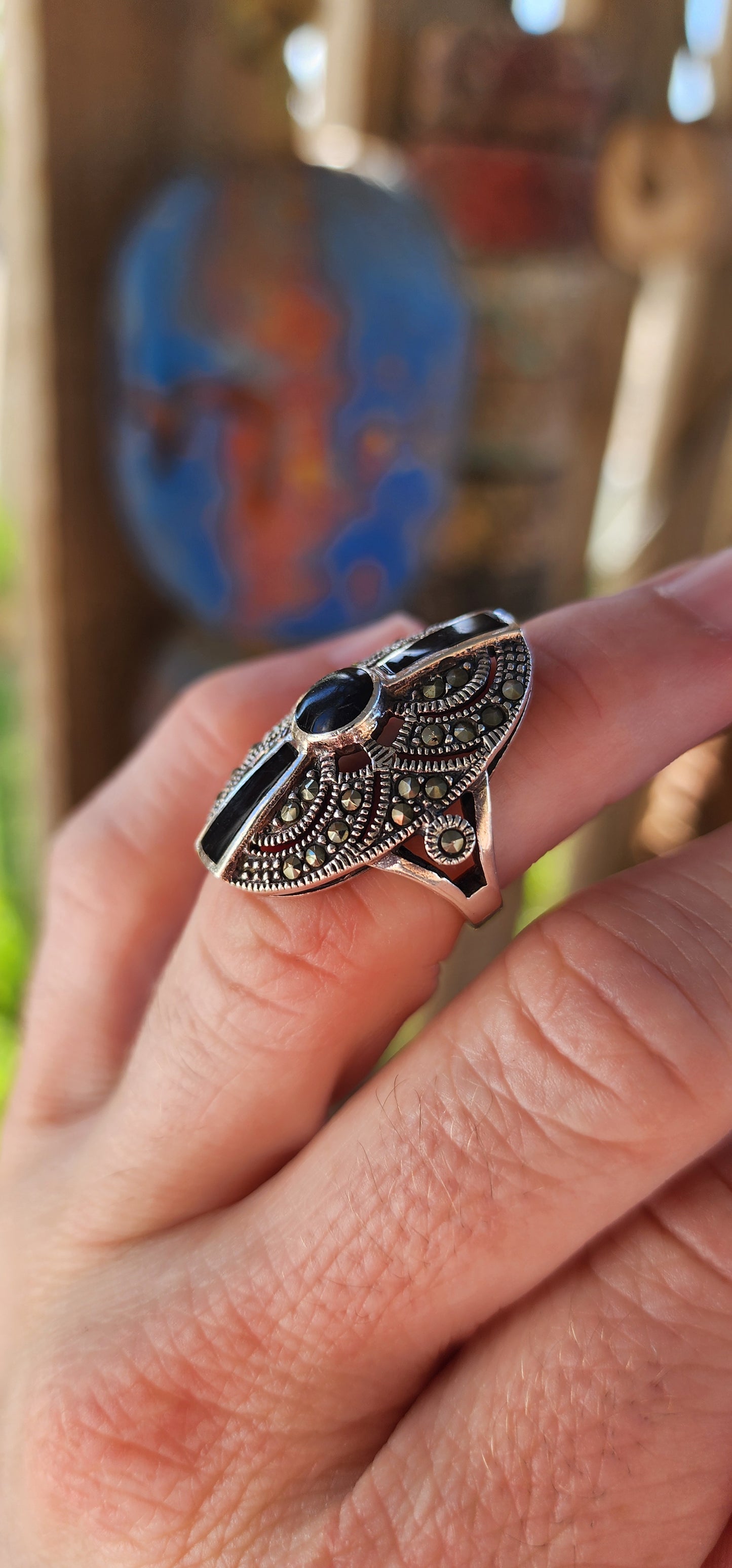 This stunning vintage 1990s sterling silver cocktail ring is a striking blend of Art Deco elegance and bold, statement-making design.