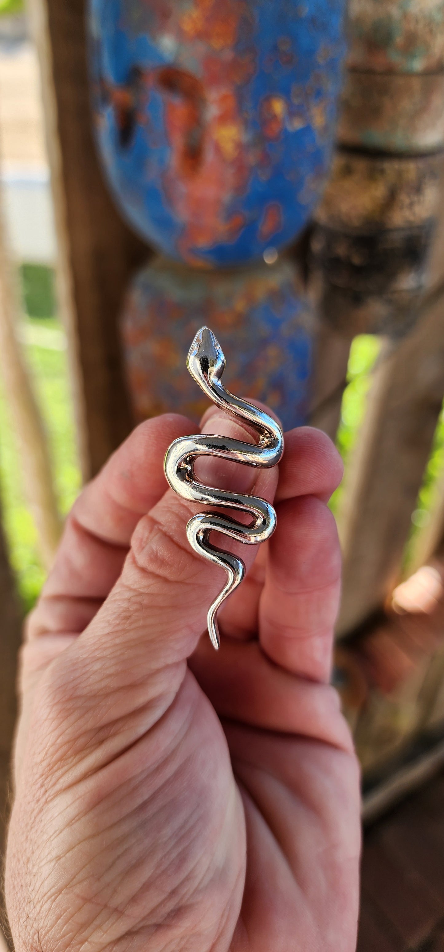 This chunky sterling silver serpent ring is a striking fusion of power, mystery, and elegance. Sculpted with a smooth, high-polish finish, the snake coils effortlessly around the finger.