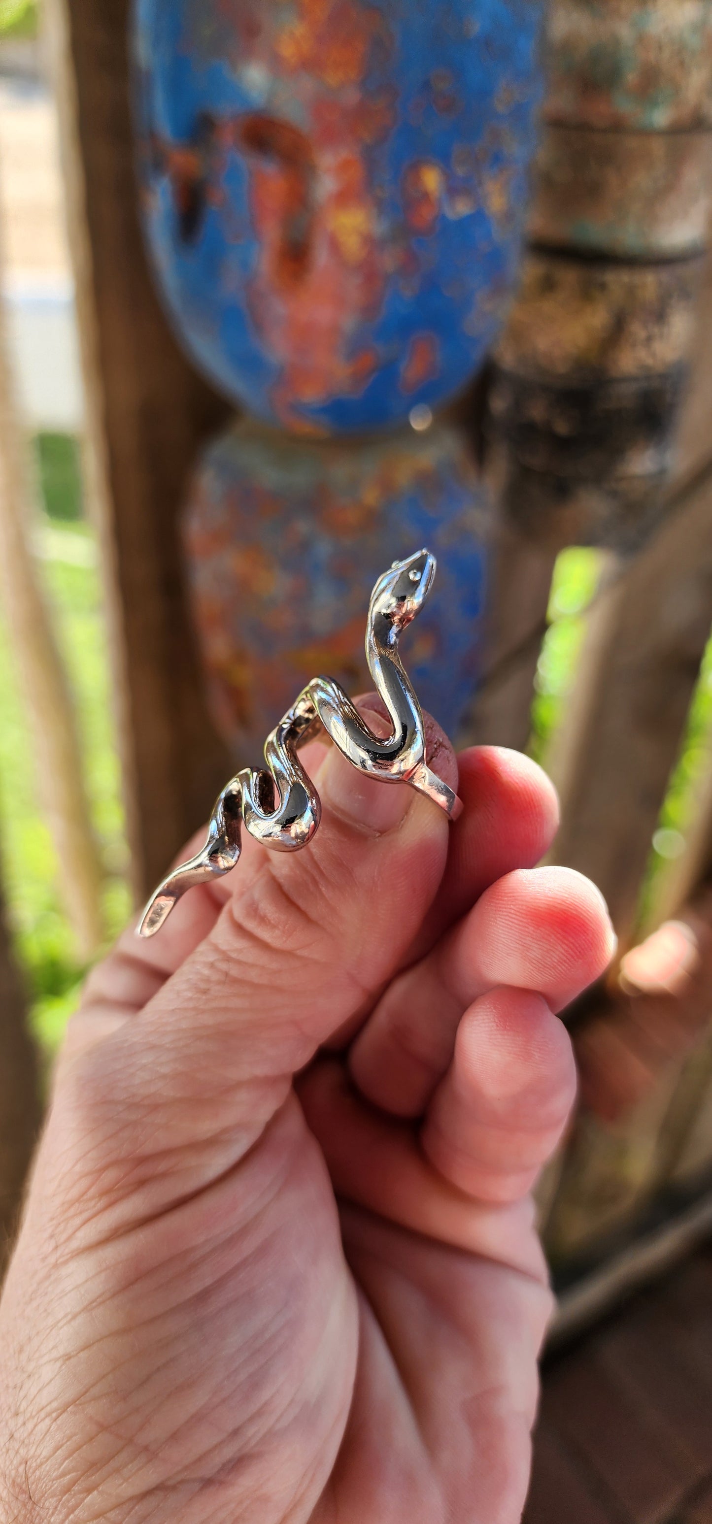 This chunky sterling silver serpent ring is a striking fusion of power, mystery, and elegance. Sculpted with a smooth, high-polish finish, the snake coils effortlessly around the finger.