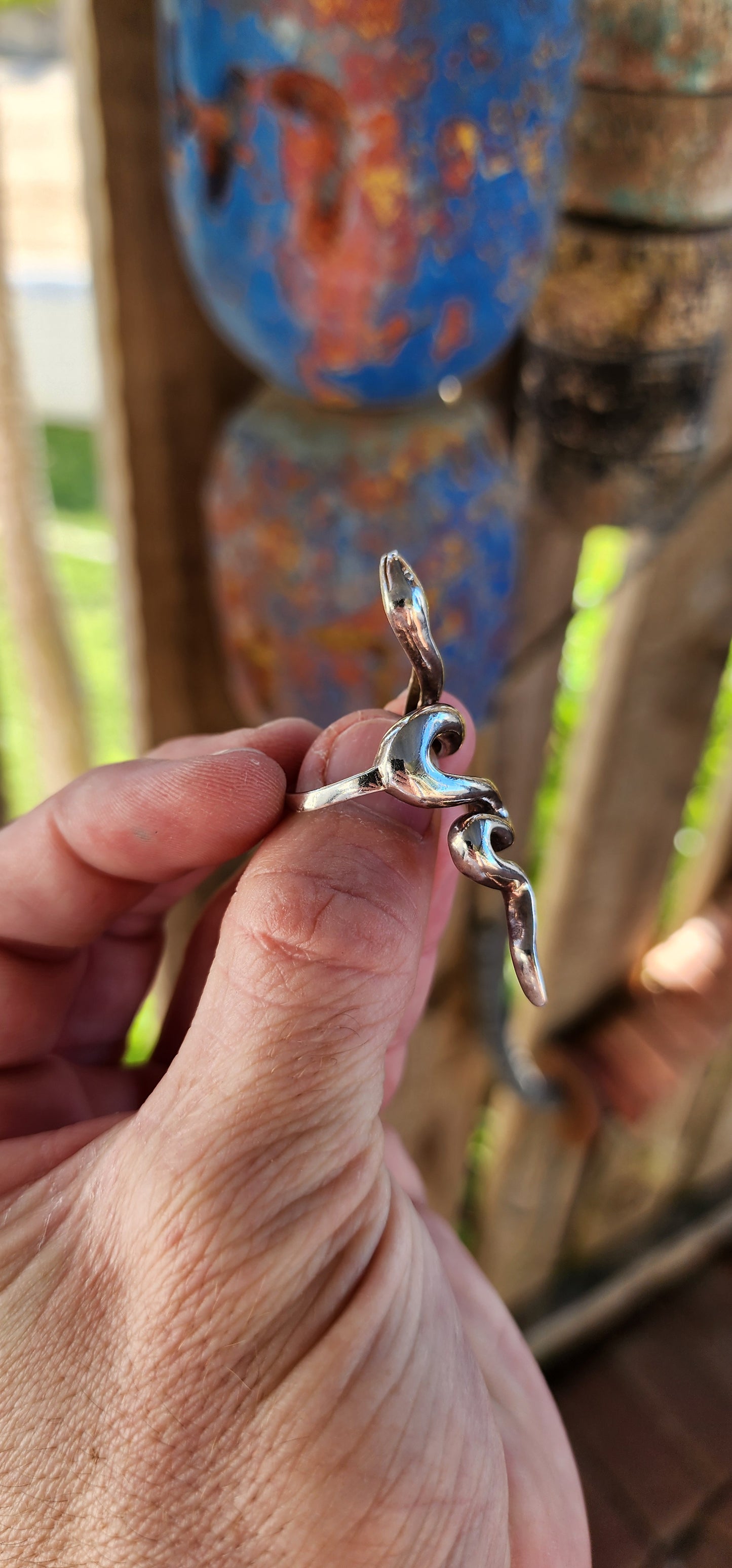 This chunky sterling silver serpent ring is a striking fusion of power, mystery, and elegance. Sculpted with a smooth, high-polish finish, the snake coils effortlessly around the finger.