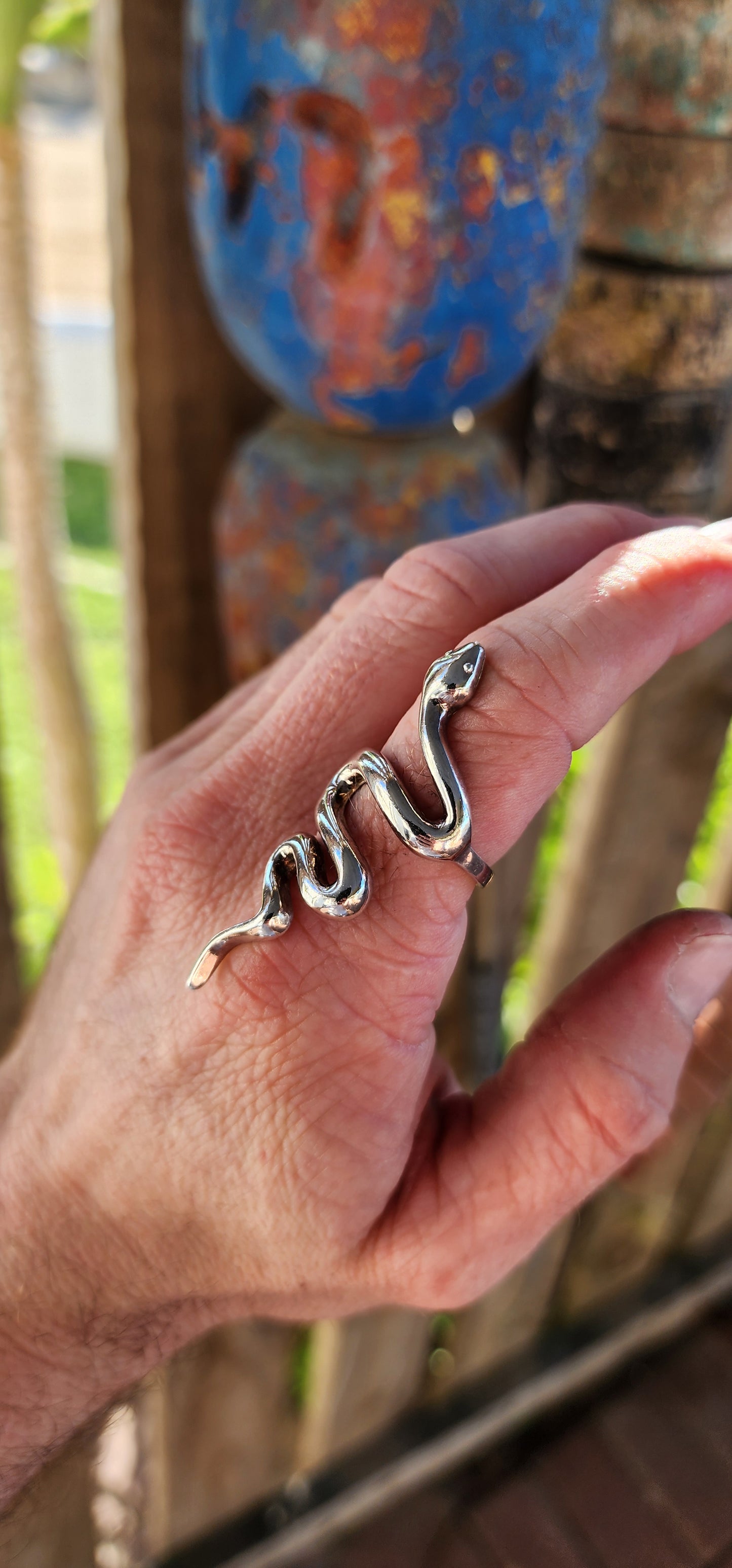This chunky sterling silver serpent ring is a striking fusion of power, mystery, and elegance. Sculpted with a smooth, high-polish finish, the snake coils effortlessly around the finger.