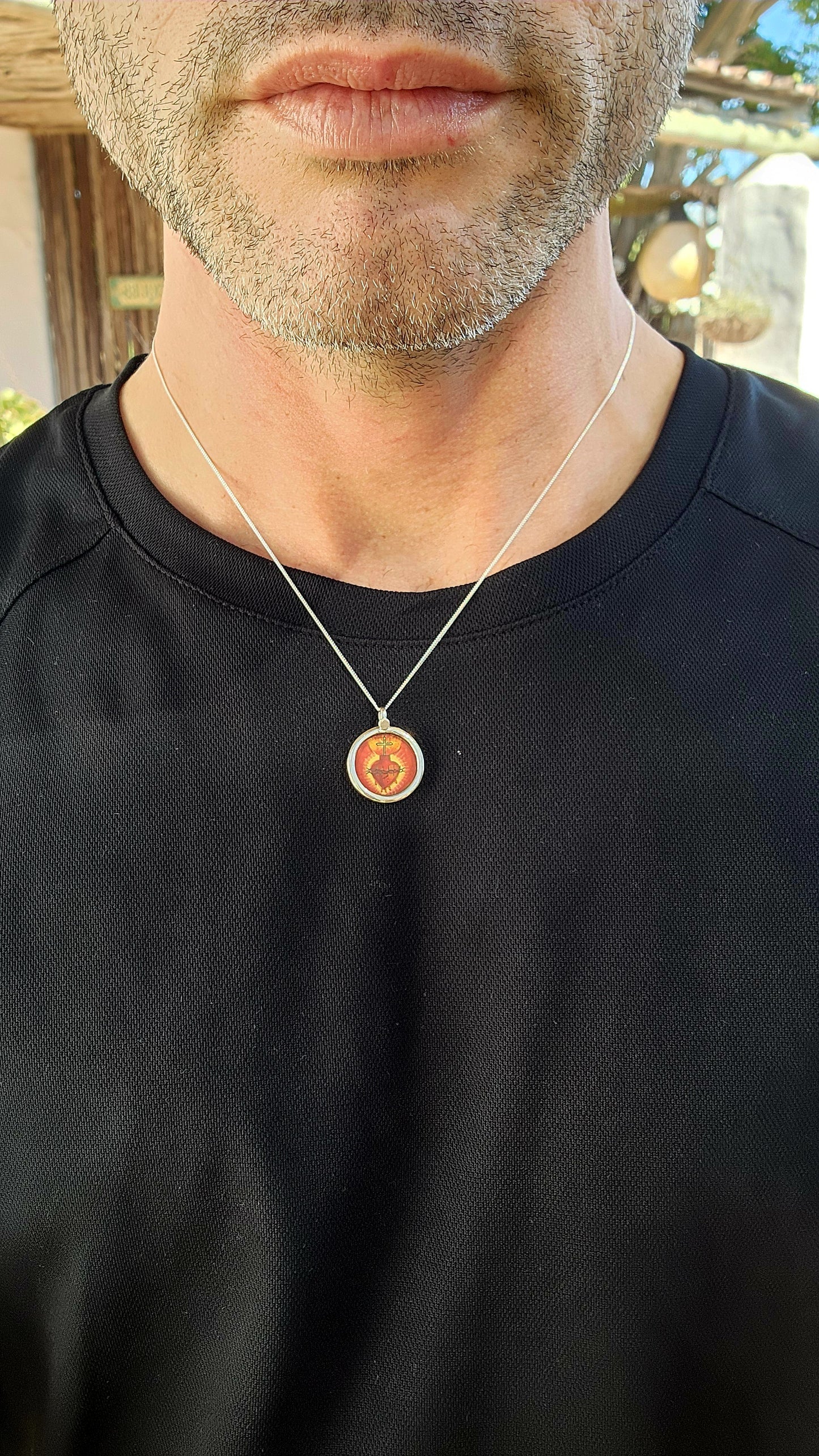 This miniature Sacred Heart hand-painted pendant is a true treasure—a little window into faith, history, and old-world craftsmanship, all wrapped up in sterling silver and glass!