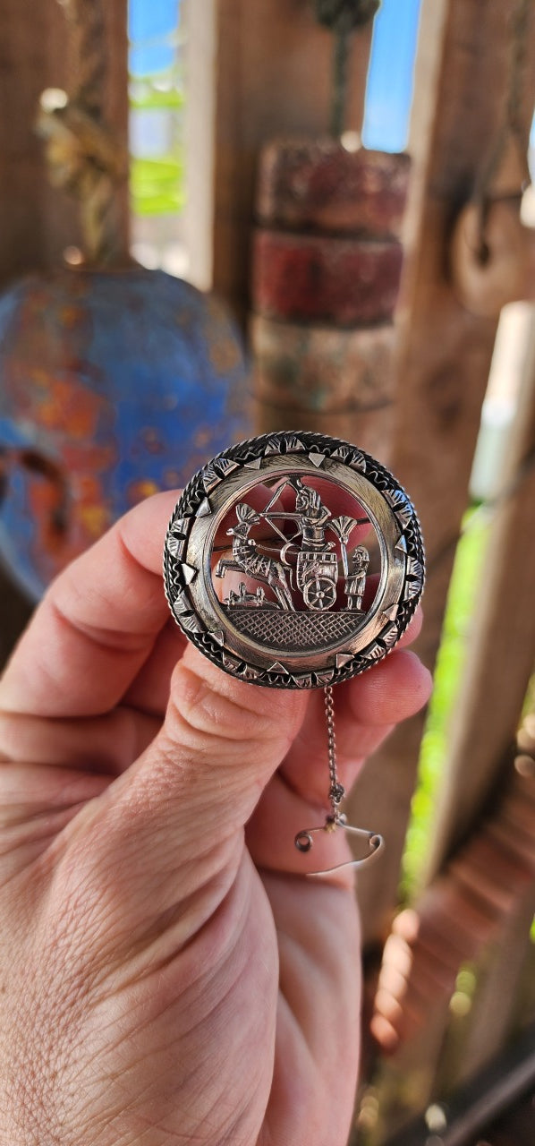 This 1940/50's Egyptian Revival sterling silver brooch is a stunning and intricately crafted piece that pays homage to the grandeur of ancient Egypt.