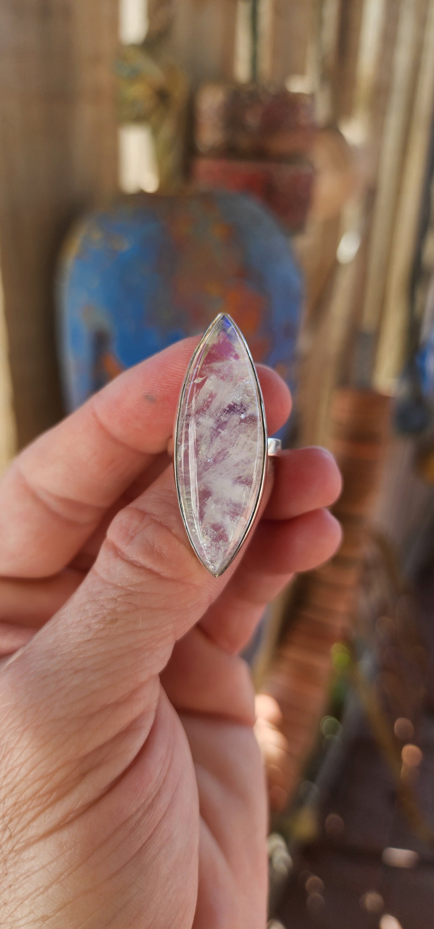 This breathtaking sterling silver statement ring is a true showstopper, designed for those who revel in the mystical and extraordinary. At its heart lies an impressively large marquise-cut blue moonstone cabochon.
