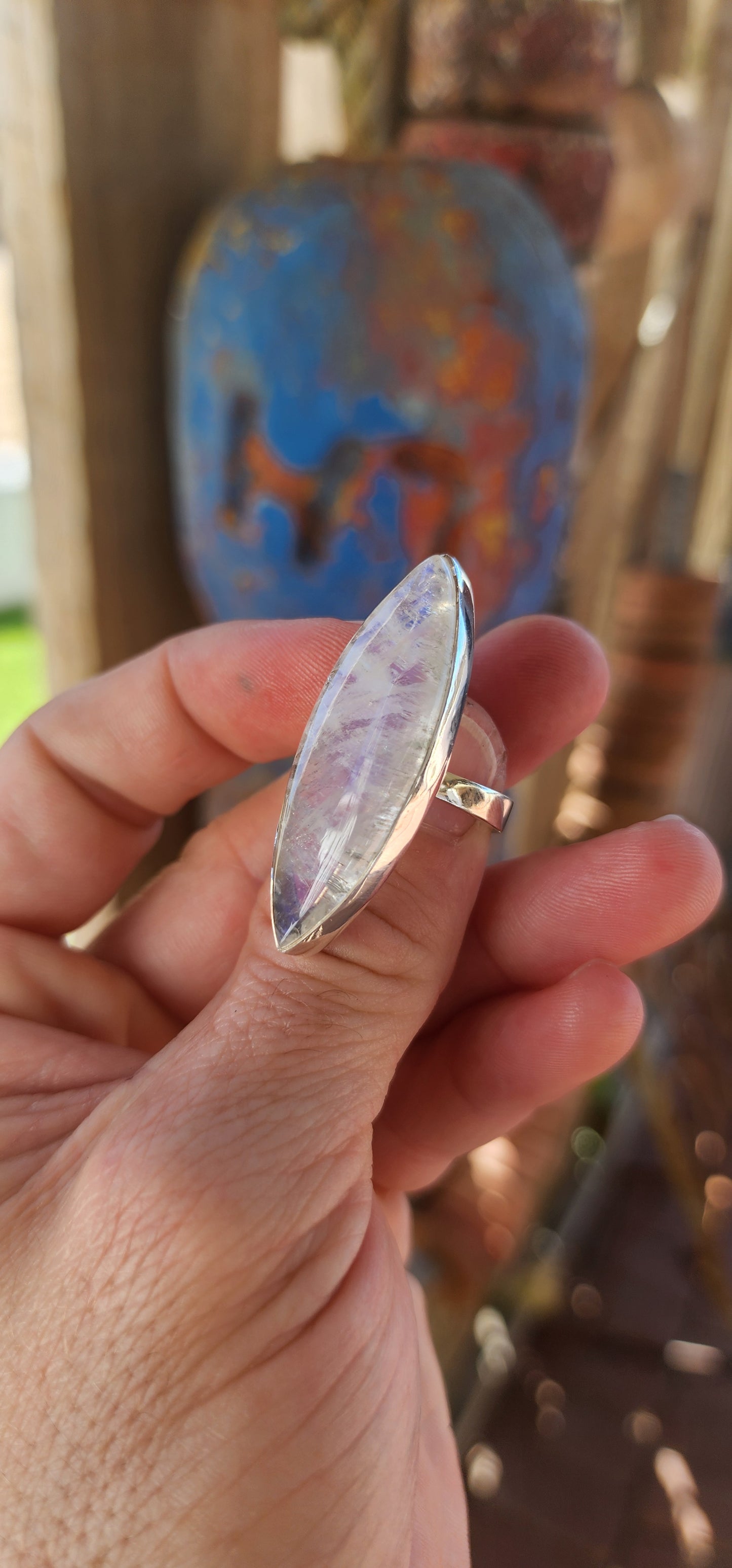 This breathtaking sterling silver statement ring is a true showstopper, designed for those who revel in the mystical and extraordinary. At its heart lies an impressively large marquise-cut blue moonstone cabochon.
