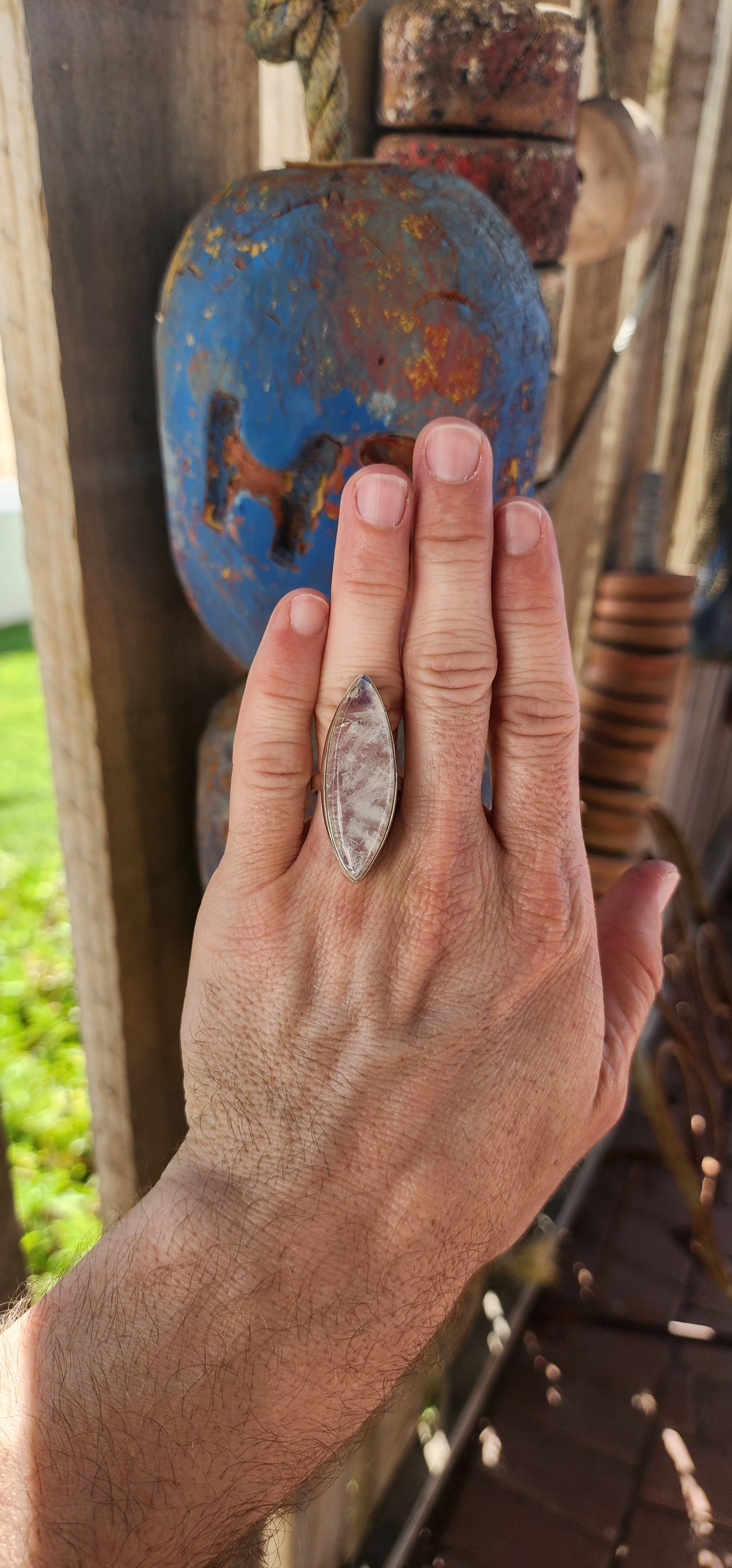 This breathtaking sterling silver statement ring is a true showstopper, designed for those who revel in the mystical and extraordinary. At its heart lies an impressively large marquise-cut blue moonstone cabochon.
