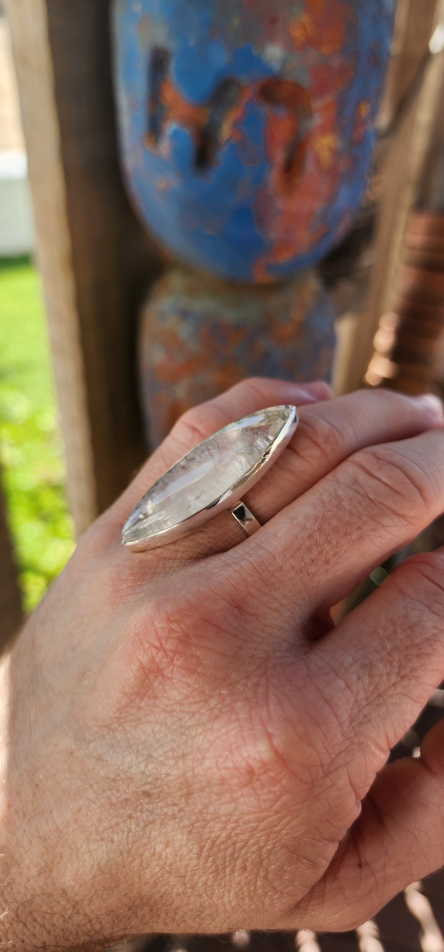 This breathtaking sterling silver statement ring is a true showstopper, designed for those who revel in the mystical and extraordinary. At its heart lies an impressively large marquise-cut blue moonstone cabochon.