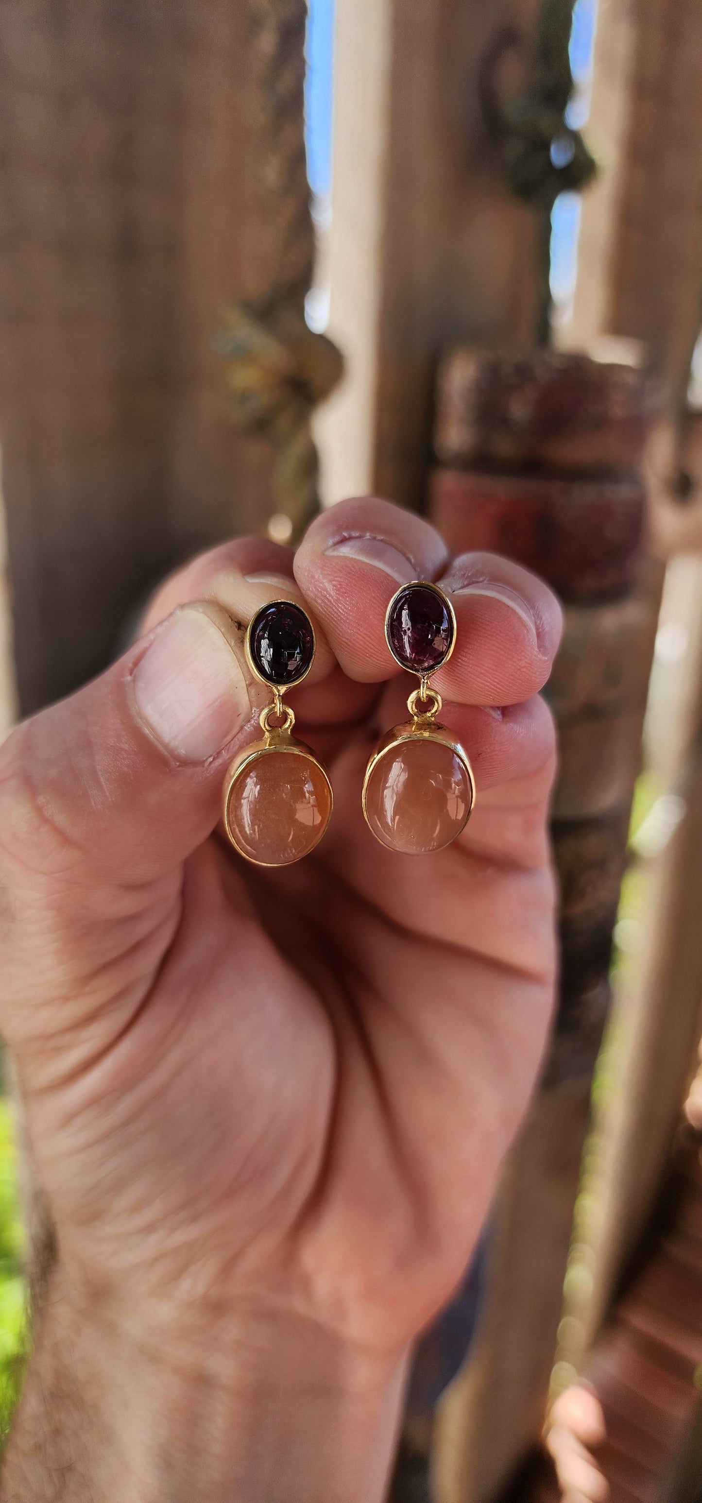 These exquisite two-tier drop earrings are a perfect blend of elegance and warmth, crafted from sterling silver with an opulent 18ct yellow gold plating.