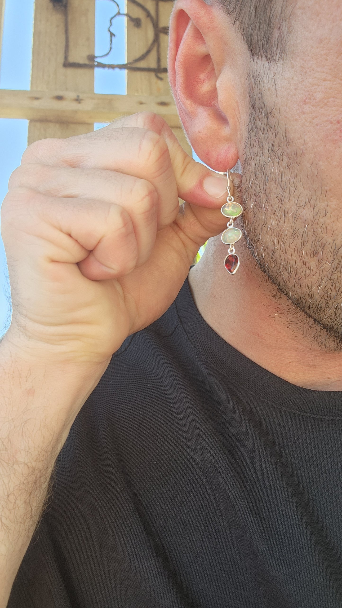 These exquisite sterling silver drop earrings are a mesmerizing fusion of fire and light, elegantly showcasing two birthstone options in a timeless, sophisticated design.