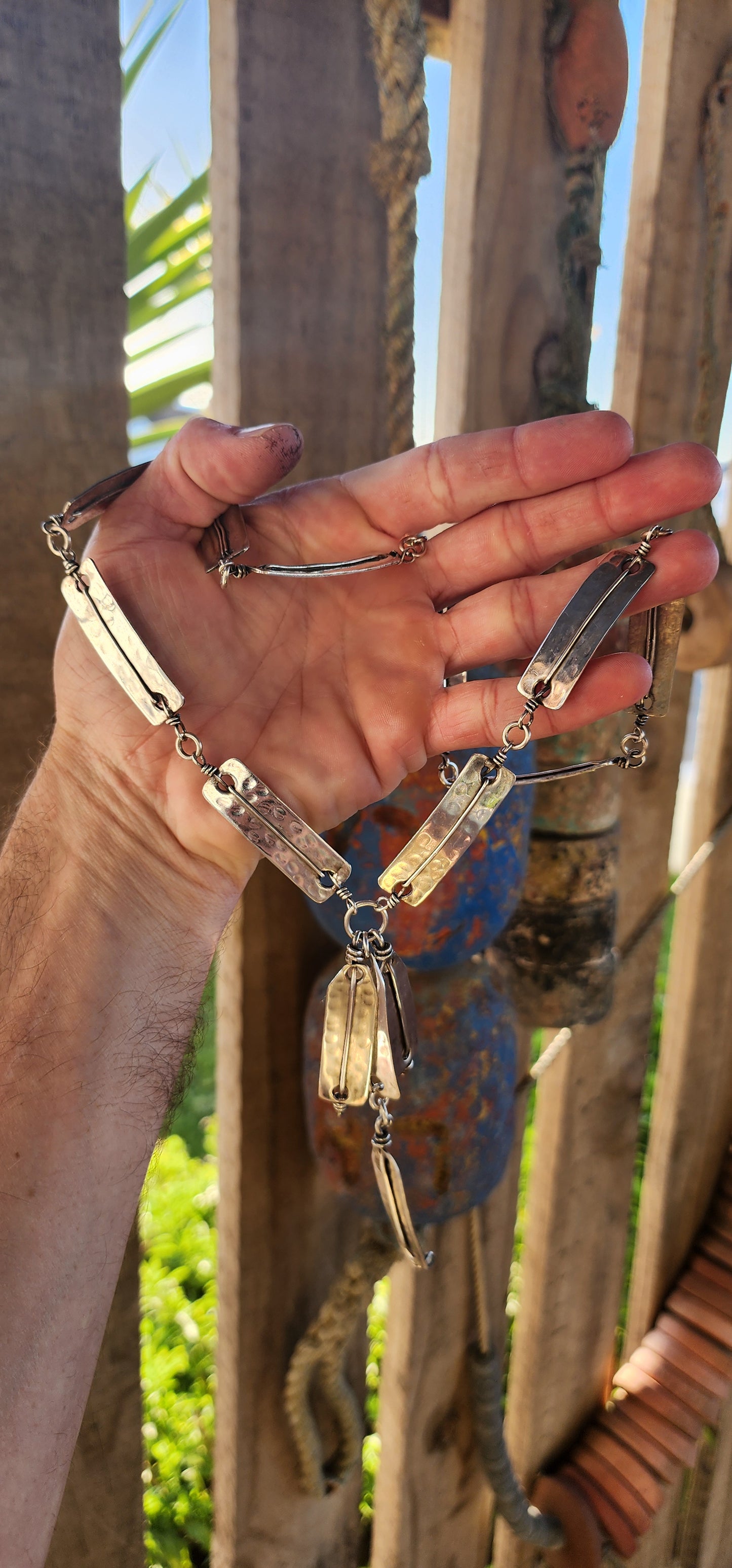 This striking vintage 1970s artisan-made modernist/brutalist silver-plated panel necklace is a bold statement of raw craftsmanship and industrial elegance.