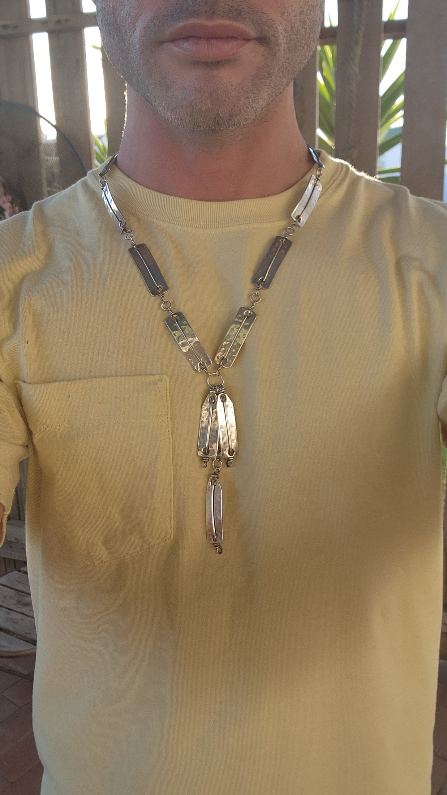 This striking vintage 1970s artisan-made modernist/brutalist silver-plated panel necklace is a bold statement of raw craftsmanship and industrial elegance.
